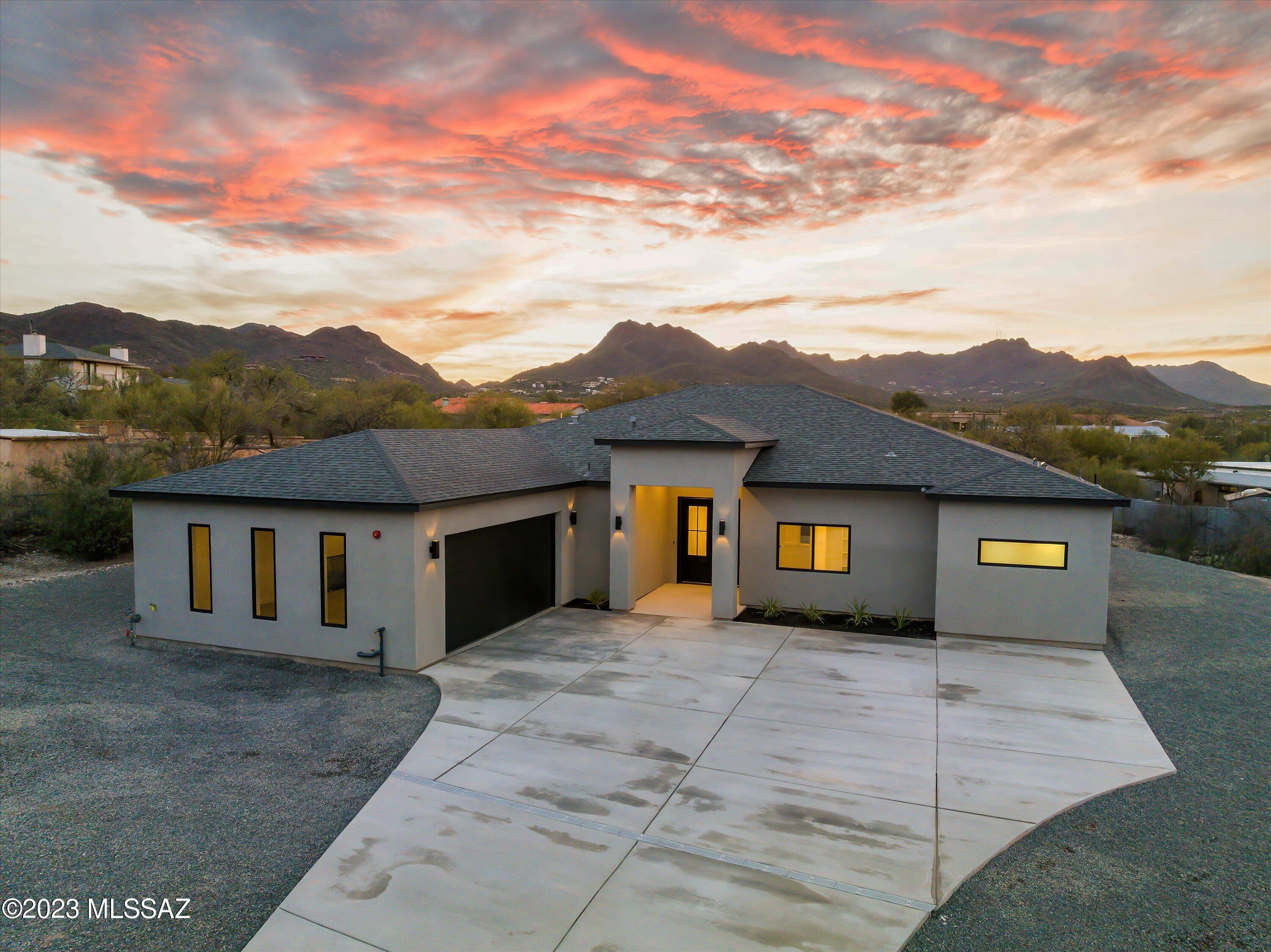 This modern, open concept design home has been constructed with openness and clarity top of mind, seamlessly converging with its surrounding natural environment, truly embodies and captures the best of desert living. This Sophisticated interior boasts wood-look tile flooring, upscale light fixtures/ceiling fans, a Modern great room with fireplace, Breathtaking custom alder wood kitchen is equipped with a 6-burner gas range, huge pantry, wine & beverage cooler, and a massive 9ft quartz island. This home also features plenty of storage throughout, a large laundry room with custom cabinets, sink and quartz countertop.  A lavish ensuite with floating double vanity, freestanding bathtub next to an impressive walk-in shower with multiple shower heads. premium over an acre lot with plenty of space for RVs , future pool and more. Close Proximity to I-10, downtown and many hiking trails.   

come tour today!
Owner/Agent.