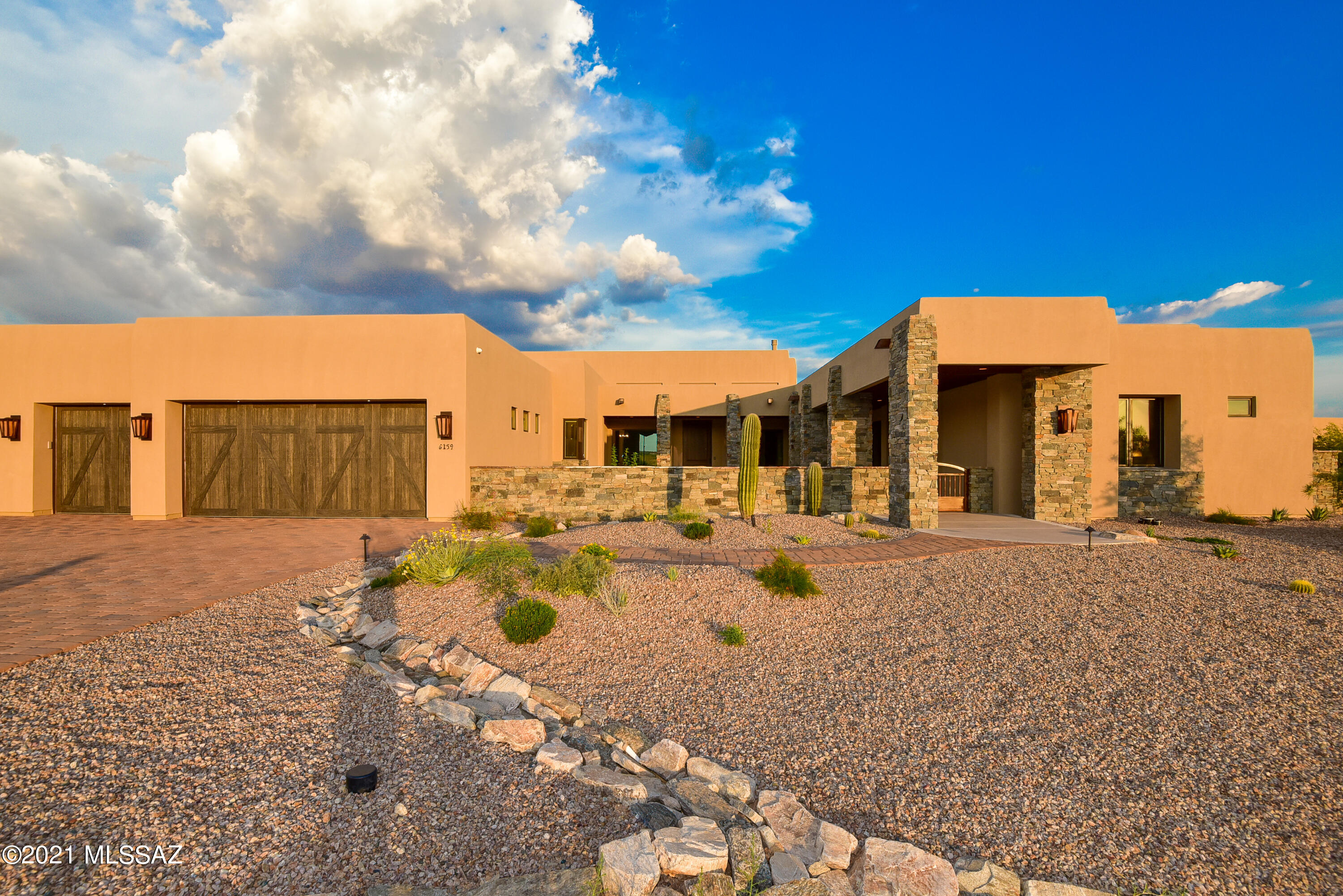 Stunning Custom Home within the gates of The Ritz-Carlton Residences, Dove Mountain. Situated on the 3rd fairway of The Golf Club at Dove Mountain this home has views of three mountain ranges and the sparkling city lights. Enjoy access to all the amenities of the Ritz-Carlton hotel as well as concierge services and owner events.