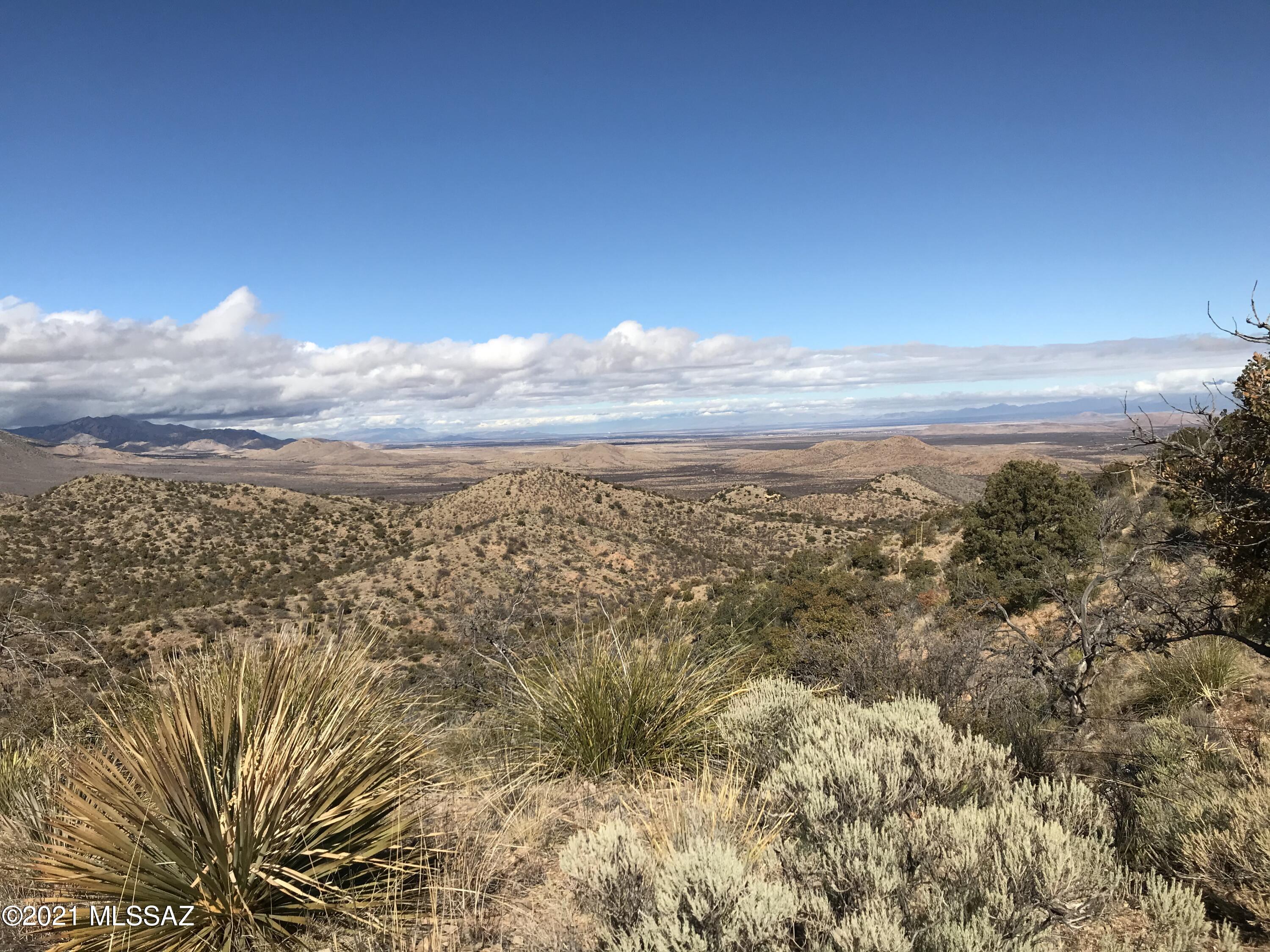 These kind of lots don't come up often in High Lonesome! For the first time on the market in years, this amazing mountain top land is almost 10 acres
overlooking miles of farmland, rolling hills, and Cochise County's wealth of Pistachio & Pecan
Groves. Catch the gentle breeze from your newly built masterpiece home with patio spaces to sit
and watch the sunset. Electric is roughly 100 feet away, with water and septic remaining to be
installed by the new buyer. This private hillside is waiting for its new owner!