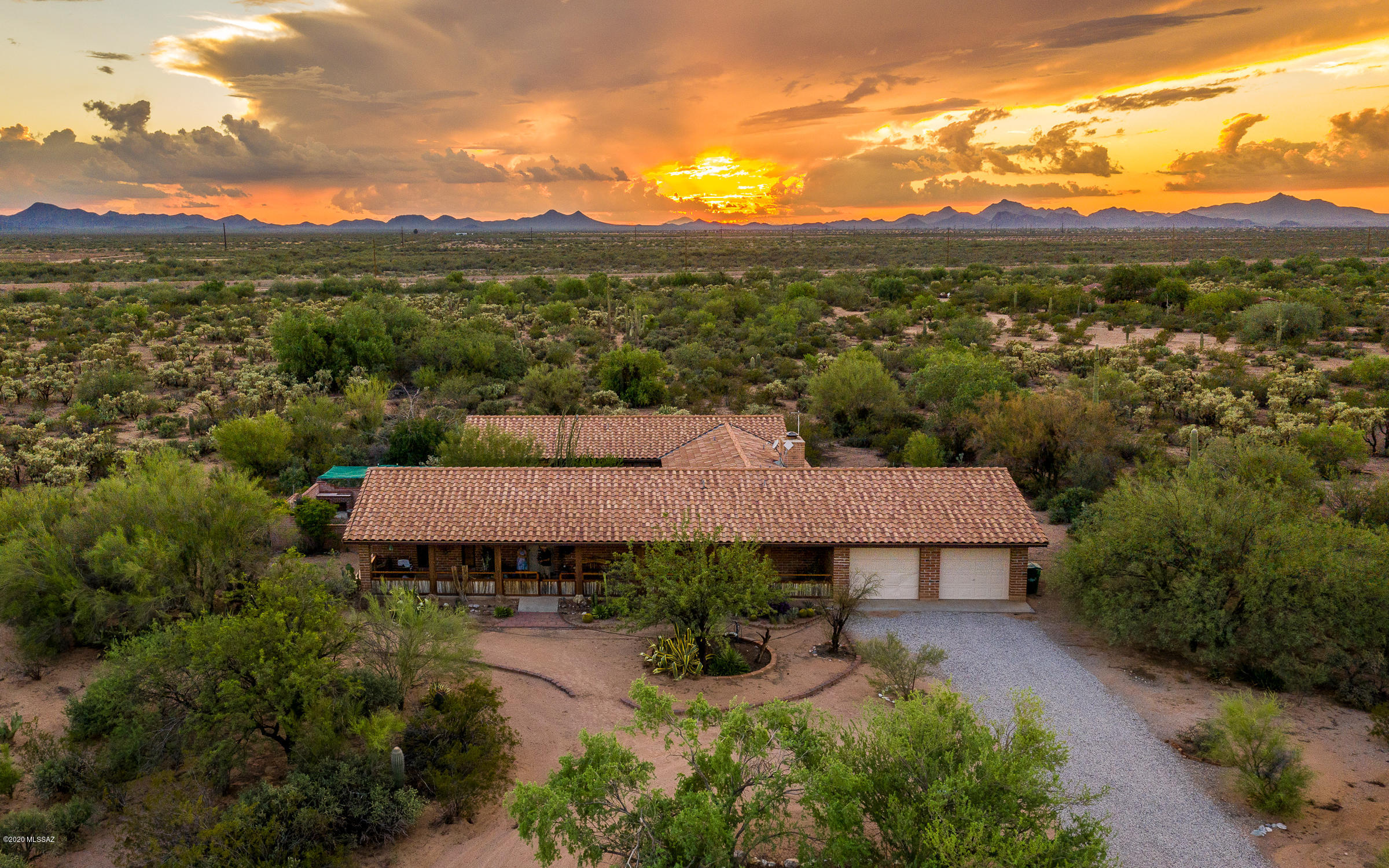 Custom Ranch style home on 9.99 Acres of lush natural desert. Fabulous Tucson Mountain, sunset and sunrise views!  Nature lovers paradise! This 2810 sq. ft. home features 3 bedroom, 2.5 bathrooms, Saltillo tile floors, custom built ins, Wells fireplace, large rooms, oversized 2 car garage, new heat pumps with whole house air purifiers and new water heater.  Exterior has Courtyard, covered porch, enclosed Veg. garden, and owned water well.  Near Saguaro National Park West and the Sonoran Desert Museum. This is a great location for hiking, birding, wildlife viewing, stargazing, biking, and running.
