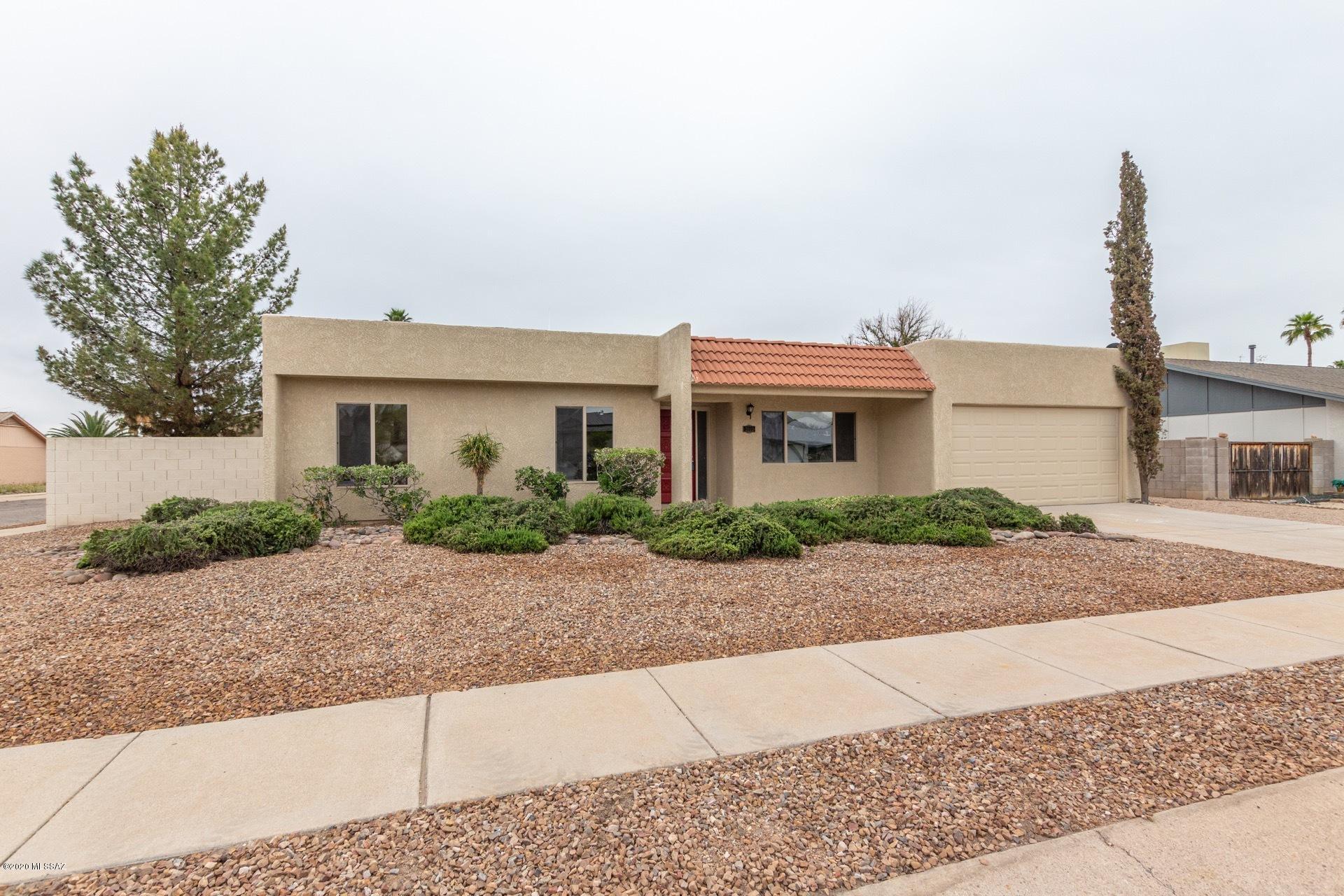 Seller will accept or counter offers from $269,000 - $274,900.  Come and see this immaculate home located on a corner lot in desirable Northwest Tucson.  When you walk through the entry of this stunning house, you will find a formal living room on your right continuing on to  an inviting family room with a cozy fireplace that opens up to a stunning kitchen and dining area.  The kitchen boasts magnificent granite counter tops, stainless steel appliances, and a large pantry. The master bedroom  has direct access to the spacious backyard complete with a  sparking pool, above ground spa, and lots of storage.  Come and view your new home today!