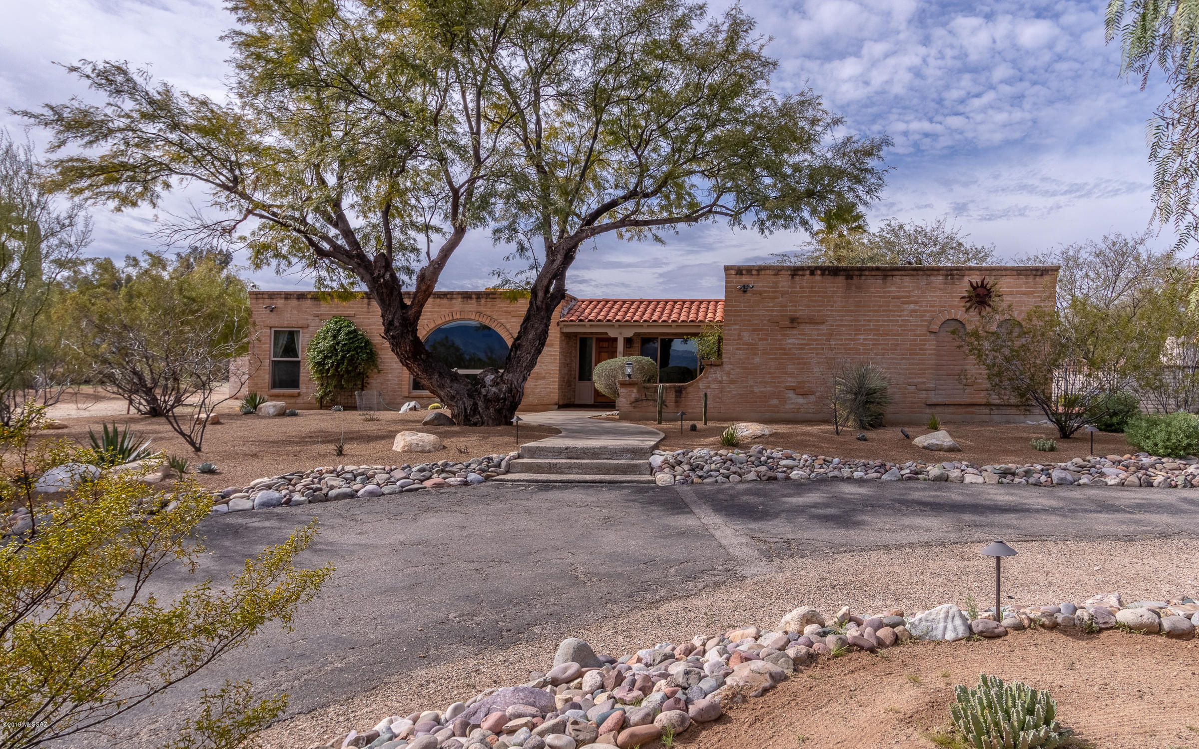 Entertainers Delight in Tanque Verde Valley on a 1.07 acre lot, Bring your horses! Excellent condition w/ quality updates! This beautiful 3 BR 2 BA Ranch home has large kitchen w/ granite countertops breakfast bar, recessed lighting, under cabinet lighting, SS appliances, rustic oak cabinets w/ soft close, pull out drawers & clever drawer organizer inserts. Breakfast nook off kitchen. Living Rm features cozy gas fireplace & wood beam & plank ceilings. Formal dining room w/ wood plank flooring. Step down front living room w/ Rincon Mountain views. New carpet in bedrooms & living rooms. Master bedroom has new carpet, walk-in closet & upgraded bathroom & patio door. Large Laundry Rm w/ kitchen pantry, storage & utility sink. Professionally Landscaped. Sparkling Pool! This is a Must See Home!