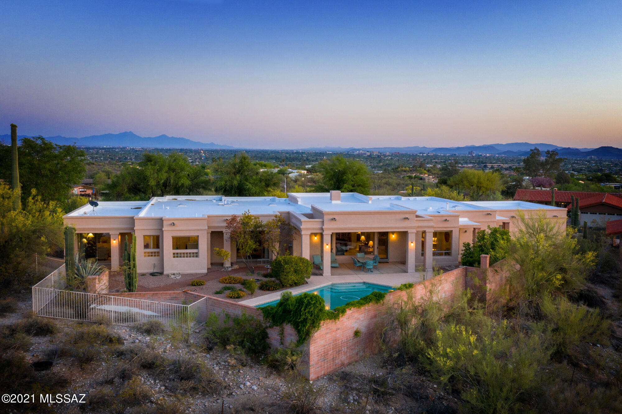 Splendid 360° mountain & city views from a hilltop home with appealing, recently renovated features. Generous great room with full kitchen. Spacious master bedroom with twin sinks, garden tub, shower and dressing room. Individual baths and walk-in closets for all other bedrooms. Sizable library that could convert to an additional full bedroom if desired. Wired ceiling fans throughout. Newer A/C units, new pool pump, and recent roof coating with warranty. RV parking available.