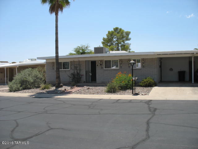 THIS HOME IS SPACIOUS WITH 2 LARGE BEDROOMS, 2 UPDATED BATHROOMS,MASTER HAS DUAL SINKS AND WALK-IN SHOWER. CEILING FANS, MIRRORED CLOSET DOORS, BEAUTIFUL TILE FLOORS IN ALL AREAS EXCEPT BDRMS. NEW A/C,PURCHASED 2015. ROOF RECOATED 2015,NEWER APPLIANCES,DISHWASHER,MICROWAVE,REF,INCL WASHER & DRYER. KITCHEN HAS GRANITE COUNTERTOPS,UPGRADED CABINETS,PANTRY. NEW DUAL PANED WINDOWS THROUGHOUT..BONUS ROOM,GREAT FOR SMALL OFFICE,SEP LAUNDRYROOM, STORAGE ROOM, ALL NESTLED IN THE BEAUTIFUL TUCSON MTNS. THIS IS A 55+ COMMUNITY, NO PETS, NO RENTALS ALLOWED, OWNER OCCUPIED ONLY.