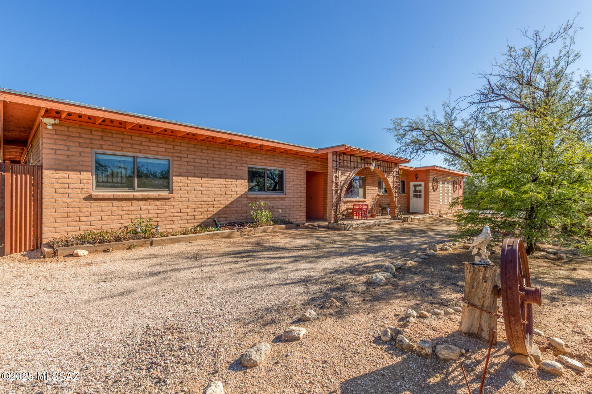 Welcome to a unique 3-bedroom gem that checks every box for convenience and charm. This home retains its beloved Mid-Century Modern character while providing all the right modern updates, including a New HVAC system and new energy-efficient windows. The true bonus is the flexibility of the grounds: Work from home in the converted storage shed, which is now a dedicated, private office space separate from the main house! The backyard is fully secured with fencing and includes a double gate for easy RV, boat, or recreational vehicle storage—a rare find without the constraints of an HOA. A newly installed water feature and rain harvesting system complete this private, flexible, and efficient property.