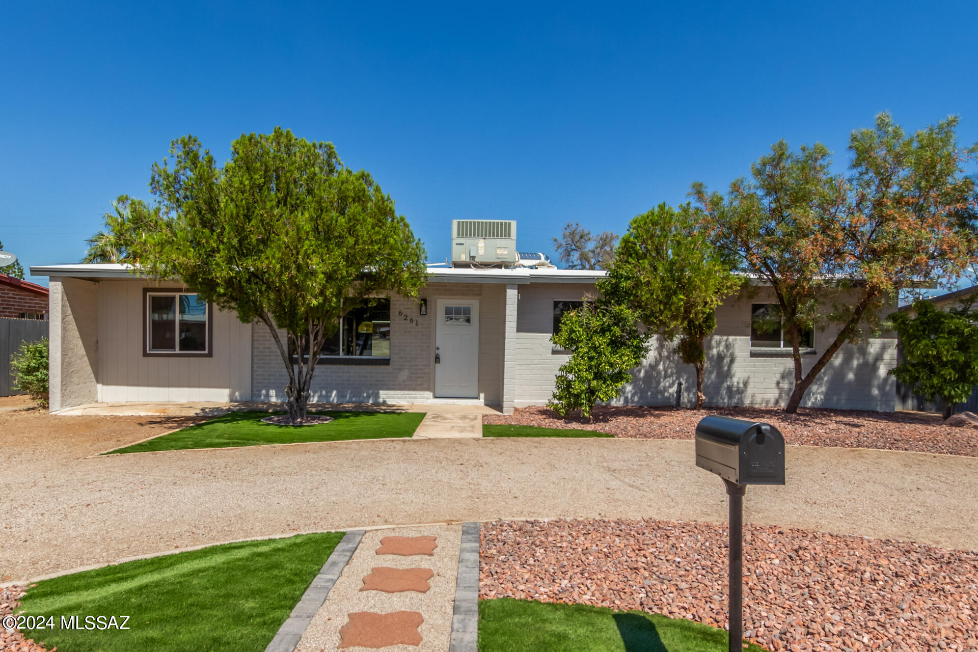 Excellent opportunity to own this renovated single-level residence in Tucson! This property offers a circular driveway, RV gate, and mature landscape. Welcoming interior boasts an inviting great room and a HUGE family room enhanced by a fireplace ideal for the cooler months. Wood-look flooring, fresh neutral palette, and dual pane windows are worth mentioning. The kitchen includes granite counters, stainless steel appliances, track lighting, and abundant cabinets. All bedrooms ensure rest and rejuvenation, offering plush carpets for warmth & comfort underfoot. The main bedroom provides a walk-in closet and a private bathroom. Oversized backyard has an open patio where you can relax after a busy day. What are you waiting for? Make it yours while it's still available!