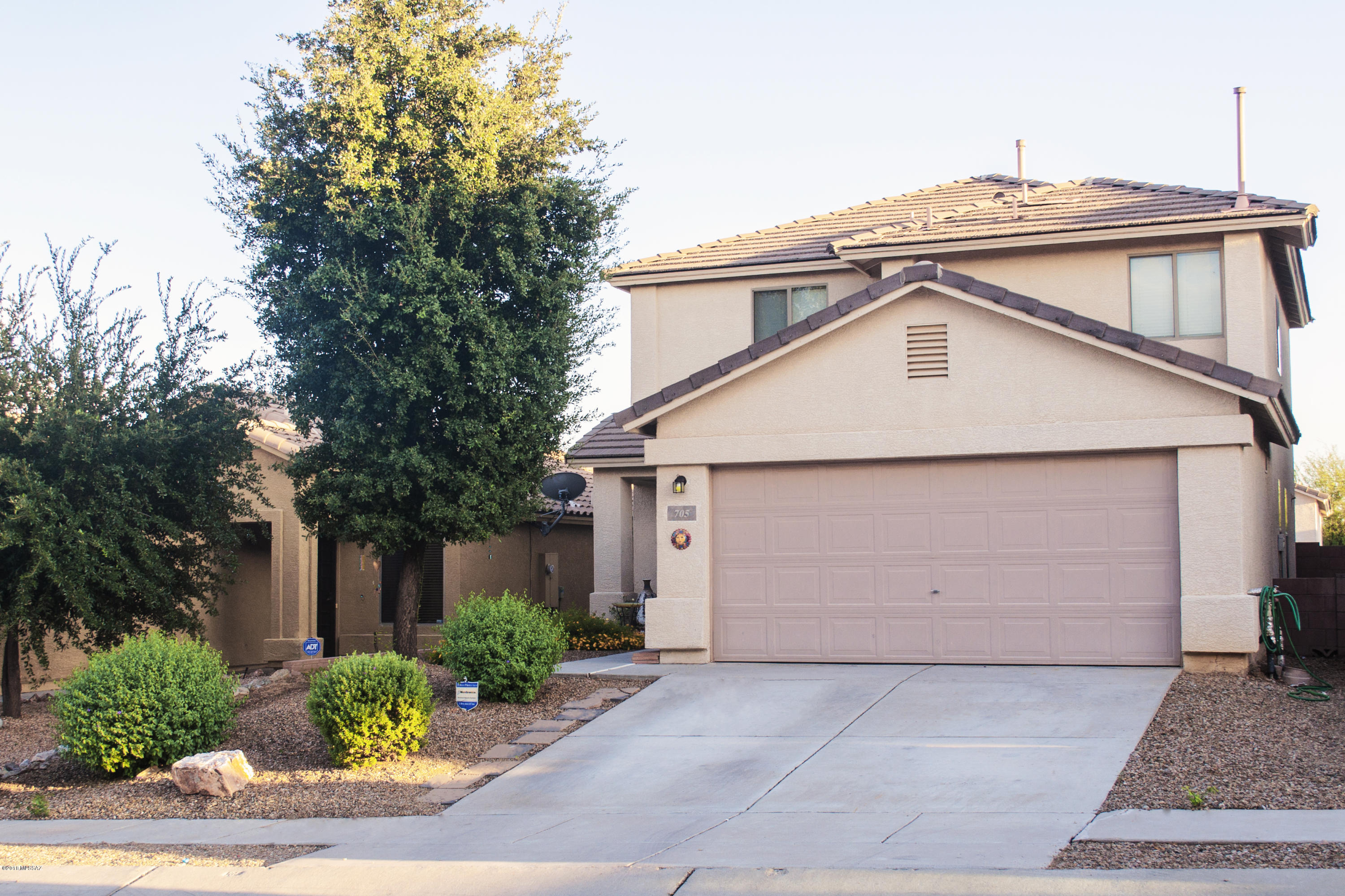 Spacious 4 bedroom, 2 bath home with a large living area on each floor of the home. Great mountain views from the upstairs den. Super-durable tiled roof.  Main floor master with en suite. Large kitchen with stainless appliances. All appliances including washer/dryer and home warranty are included with full price offer.