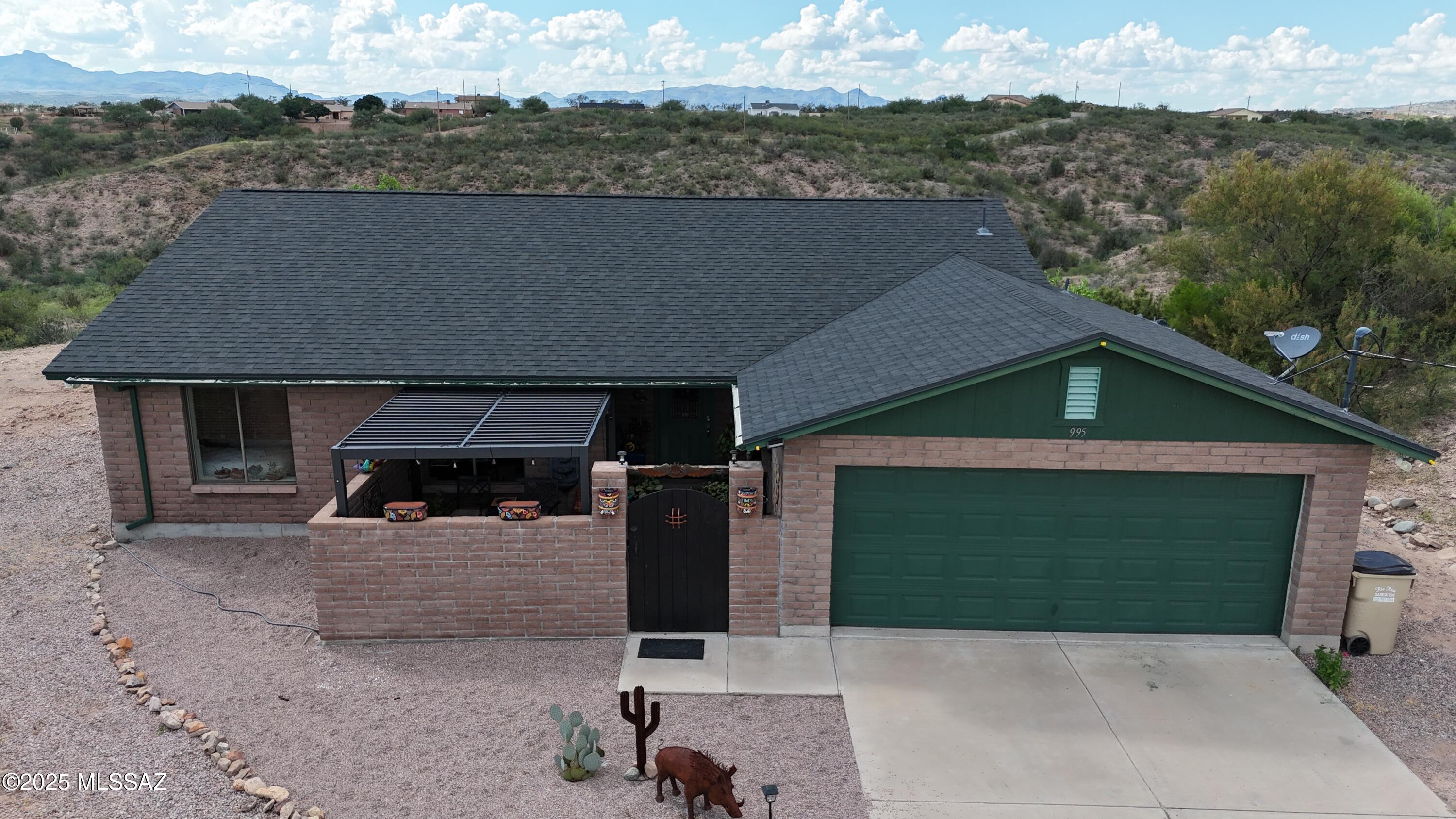 A very nice, well maintained, secluded home in East Rio Rico.  This beautiful home sits on 1.44 acres with spectacular/breathtaking views ...!!  Great location...only 10 minutes from Nogales and shopping!!   Many features include vaulted ceilings, new flooring, new roof, fresh paint, enclosed front patio, enclosed back yard with a covered patio and outdoor sink and barbeque.  A propane generator and all appliances are included !!  Has lots of privacy with it being the only house in the culdesac  !!  Owners will consider all offers.....