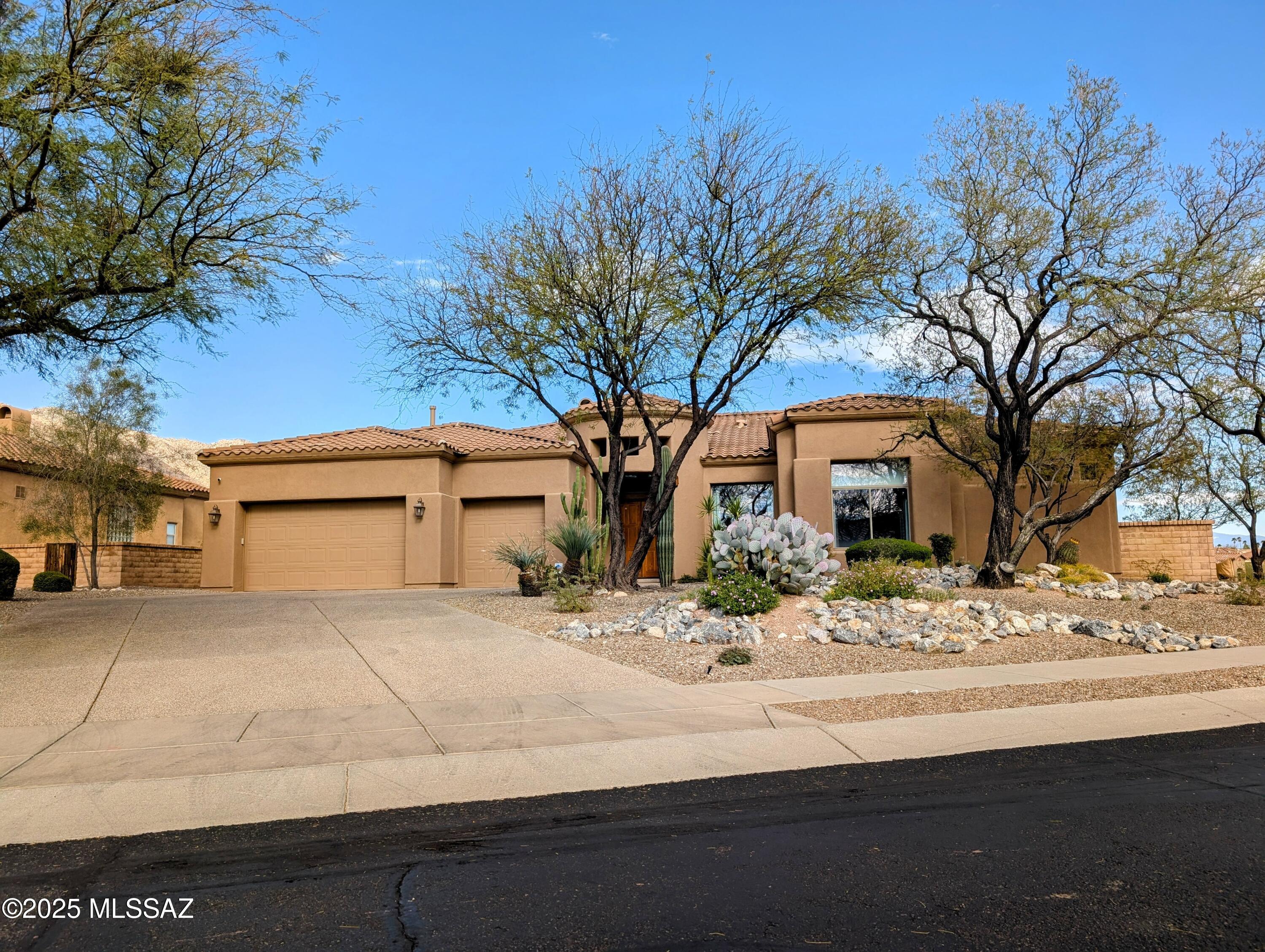 Enjoy breathtaking mountain views from this stunning home, located within the desirable gated community of Pinnacle Ridge. This property features a large open kitchen with maple cabinets, granite countertops, and a gas cooktop. The home also includes a three-car garage and a built-in entertainment center. The open floor plan is filled with natural light and boasts high ceilings. Backyard features beautiful foundation and incredible views of the Catalinas.