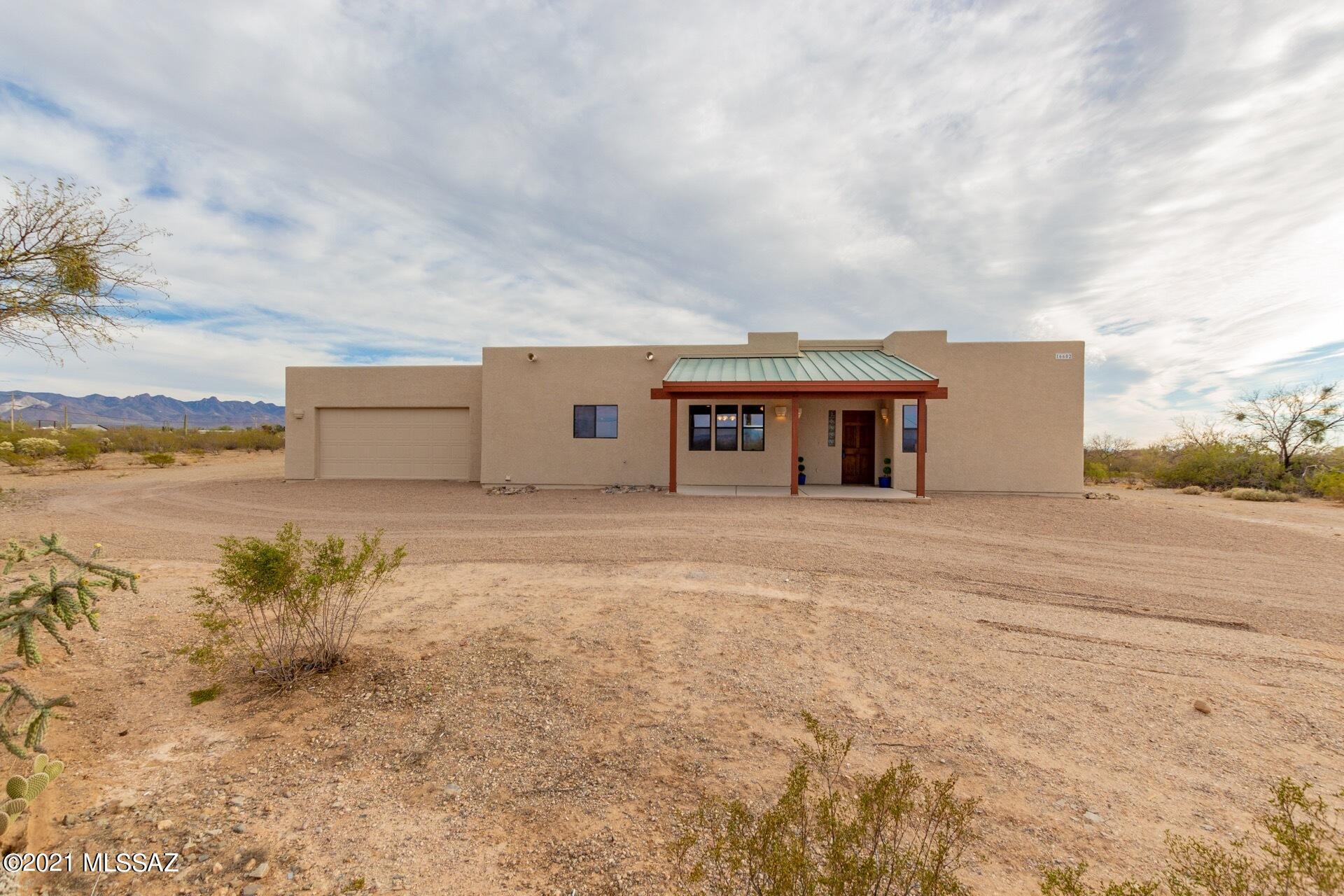 Majestic Views! This home is positioned on over 4 acres of land with a shared well, propane and septic. Beautifully remodeled 3 bedroom and 2 baths. This spacious home with bright touches, tile flooring, granite counter tops, gas stove and SS appliances. Split floor plan with sweeping views out of every window. extended garage for cars and additional storage. This home is a must see!