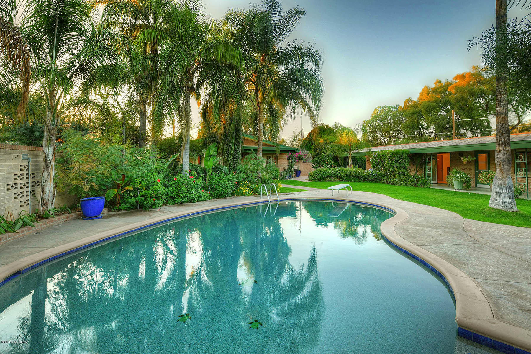 Wonderful 1960's Modern by notable Architect Arthur Brown the University Manor of Sam Hughes on nearly ½ acre!The main house is 1993 sq ft &  enjoys a large livingrm w/built in bookcases, FP. Large diningrm w/ Bay window is open to the kitchen.  Kitchen remodeled w/flr to ceiling storage, Sub Zero Fridge,SS appli, 5 burner stove, center island w/ breakfst bar, 2 wine fridges, Pella Window & exterior drs thruout. Mstr  & 2nd bedrm has hardwd flrs & French drs . Mstr  w/en-suite renovated ba 2018, w/soaking tub & heated stone flrs & counters. 2nd bathrm w/walk in glass steam shower, heated stone flrs & tile + a 1007 sq ft Gst hse w/a versatile flr plan that could be used as a 3 bedrm  2 ba or  2 bedrm + office/living space. Pebble Tech Pool! 1 car garage! Workshop! Off St parking!
