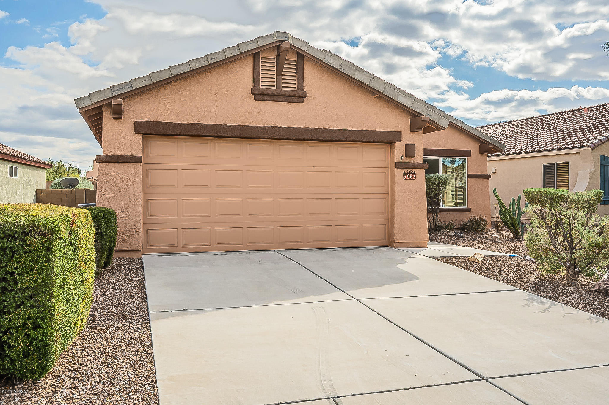 Spacious, open floor plan, 4 bedrooms/2 bath. Vaulted ceilings, tile/laminate flooring in the living areas, dishwasher, fridge, built-in microwave, electric stove/oven, water softener, washer/dryer hook ups. Updated lighting, ceiling fans, master suite with dual sinks and walk in closet. Covered patio, low care backyard with artificial grass, two car garage. Tenant to maintain salt in the water softener. Second fridge in garage & irrigation system are offered ''as is''. Seeking a six month commitment, month to month after. Security Deposit $2,392.50. Limit 2 pets. Cats/dogs OK, no puppies, no aggressive breeds. $25/month pet rent per pet. .**$28 mandatory enrollment in Resident Benefit Package. Includes HVAC filter delivery, cable internet concierge services, and more! Ask agent for detail