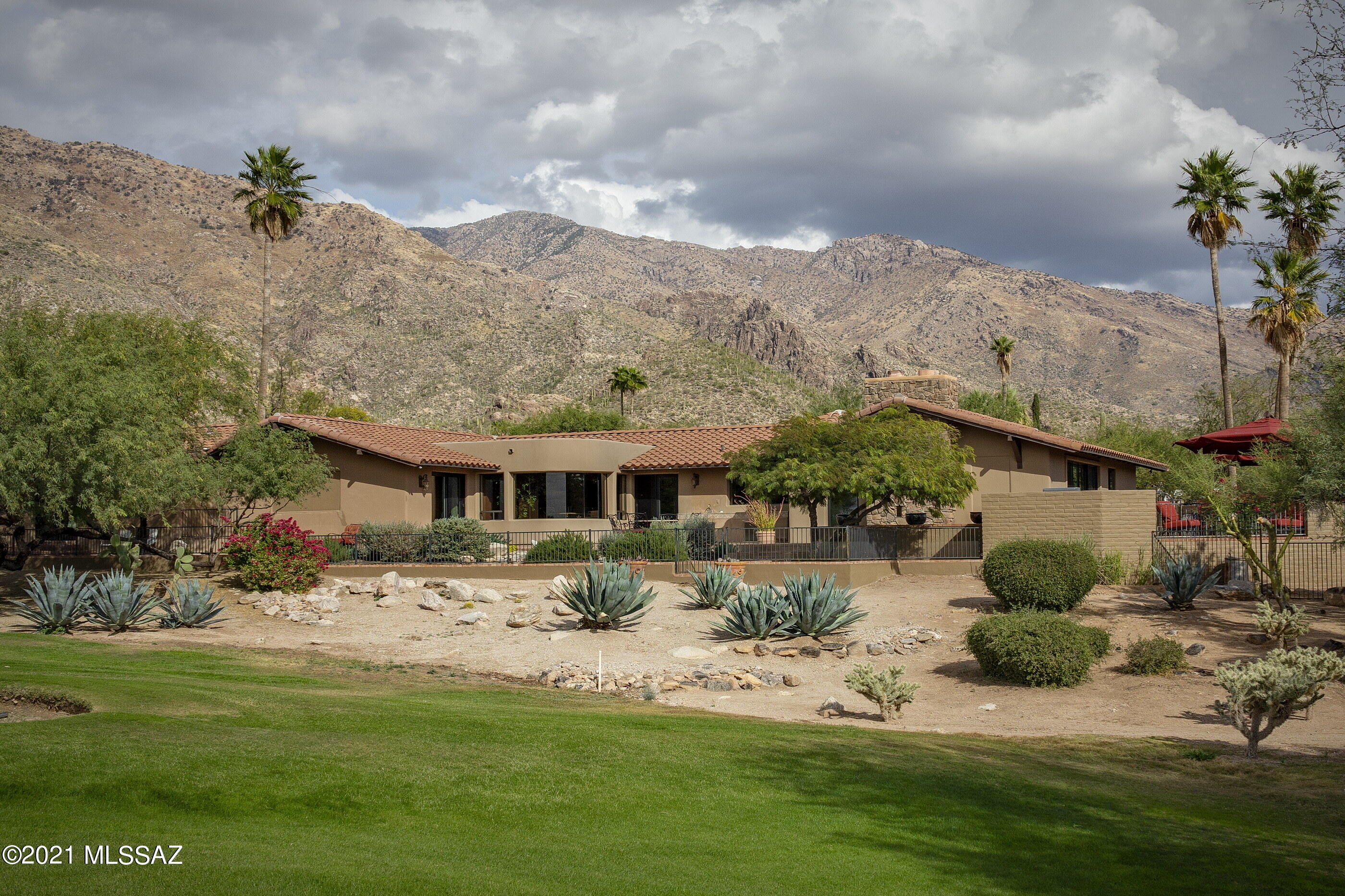 A Marriage of Luxury and Comfort on a Spectacular Golf Course Lot in Skyline Country Club Estates, Masterfully Remodeled in exquisite taste and detail, including a Deluxe ''Casita-style'' Guest Quarters with Lofty Beamed Ceiling, Gas Fireplace, Kitchenette, Private Entrance & Patio.  Nothing shows more Artistry and Sophistication than the Stunning New Windows & Doors.  Dramatic Formal Entry with dome vaulted ceiling and elegant lighting design transitions into an Open Floor Plan of sun-filled rooms with wide-open Views of Golf Course, Mountains and City Lights.  No Interior Steps!  Form, Function and Style  describe the Sleek Modern Kitchen with 5 Burner Gas Cook-top, Double Ovens, Warming Drawer, Pot Filler, Over-sized Beverage Cooler and Large Pantry.  An Entertainer's Dream! The Casual Dining Area with Expansive Bowed Window is the perfect place to begin and end each day, where amazing sunsets and twinkling city lights never grow old.  Split Bedroom Plan offers a Secluded Master Suite with Glamorous New Bathroom in a rich and restful palette of Marble Tile and Natural Stone.  Large Guest Bedroom En Suite, plus a Separate Den/Office.  You'll appreciate the Meticulously Landscaped Outdoor Living Space designed for the Lock-Up-and-Go Lifestyle, and Serious Entertaining.

Skyline Country Club is a Guard-gated Community carved into the Foothills of the Santa Catalina Mountains, where you can enjoy some of the most spectacular scenery of any golf course community in the southwest.  Limited Club Amenities included in HOA dues, or join Skyline CC and enjoy full membership privileges.  You'll love living here!