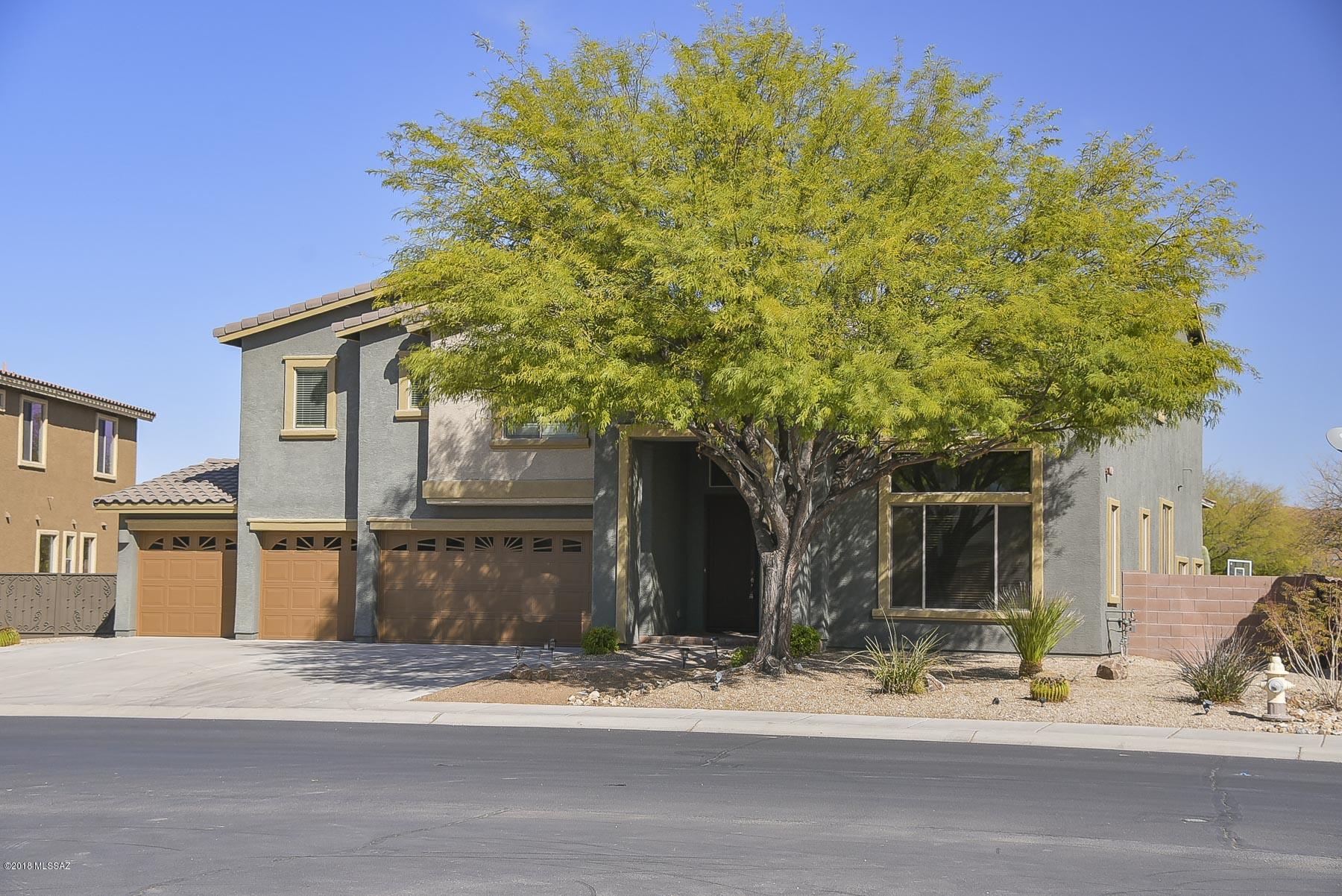 Spectacular 5 bedroom home located in a 52 home gated community has everything a family could possibly need. Private Guest quarters w/separate bath, formal dining room for those family functions, open kitchen with granite counter tops and lots of cabinets, a large bonus room with pre-wired surround sound for entertainment, dual A/C for your mstr bedroom and 2 mstr walk in closets. Walk out to the attractive back yard with custom built gas fire pit and no maintenance artificial lawn. This premium lot features Sombrero Peak views and room for pool or your own touches. So much to see!