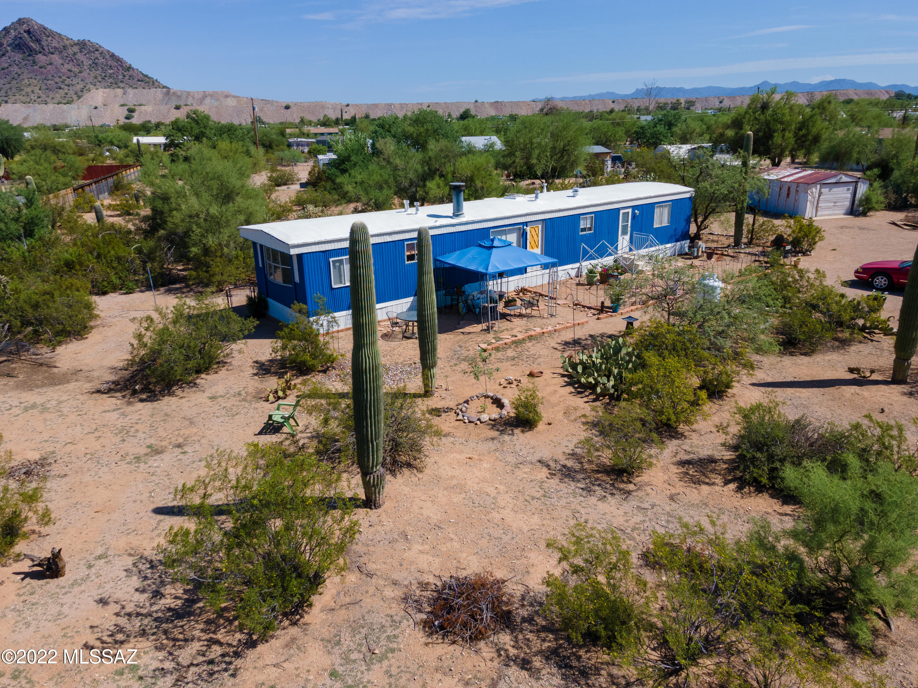 Cute as a button property in Picture Rocks.  Beautiful Saguaros and natural desert plantings fill the landscape of this large 1 acre lot.  The home has had many recent updates including new bathroom fixtures, backsplash tile, paint throughout most of the home, new appliances and a custom built ''coffee bar''.  This home shows pride of ownership.  1.5 year old HVAC system!  Excellent opportunity to have a great parcel of land with a beautiful home.
