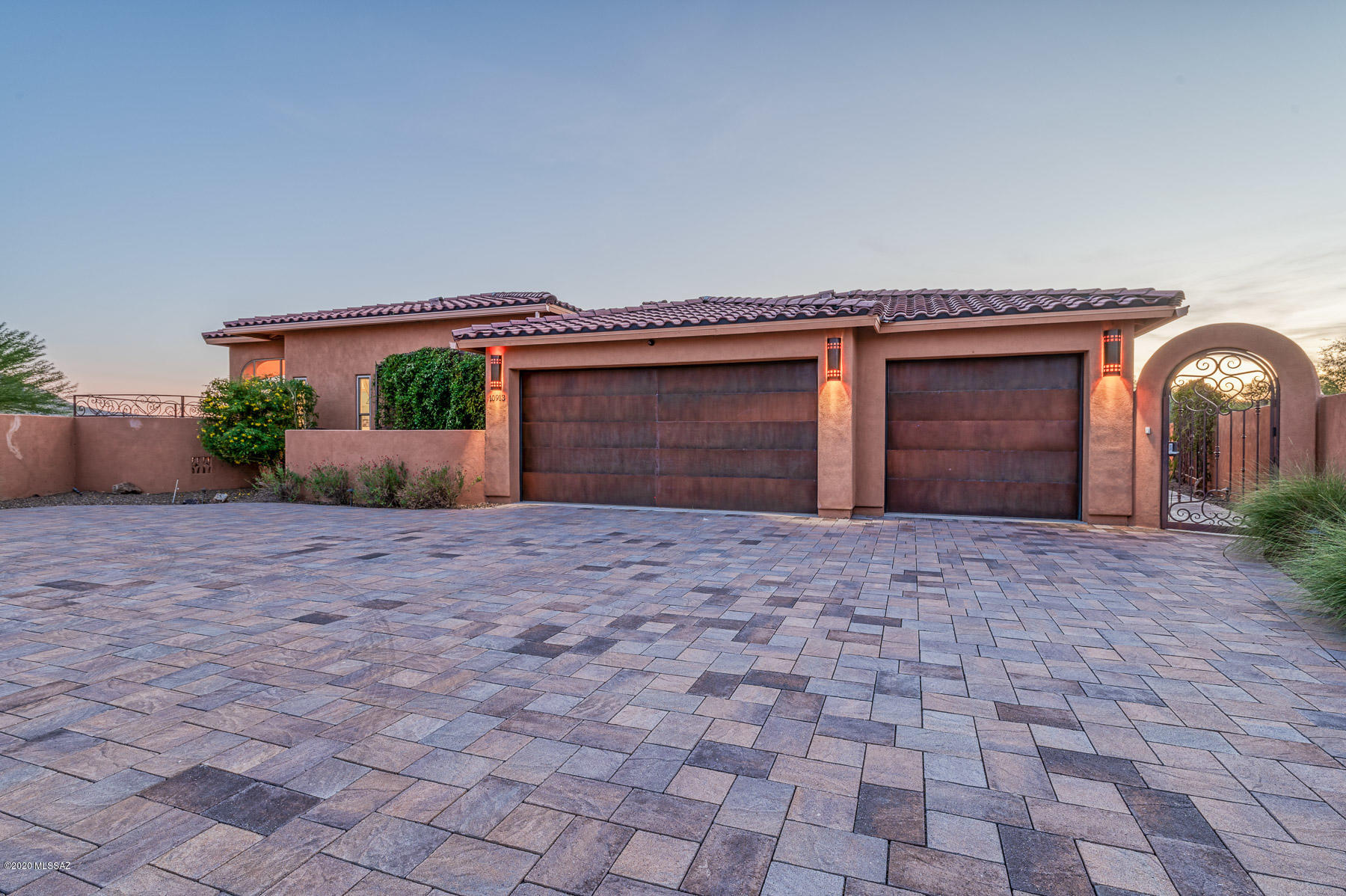 Welcome Home, Semi-Custom 2014 Sombra Built Home on nearly 3/4 of an acre. Gorgeous home perfectly placed higher than surrounding homes to fully enjoy the Majestic Views of Pusch Ridge and the Catalina Mountains. Backyard Oasis, 17x40 pebble Tec, solar and gas heated pool w/ integrated spa & waterfalls. 2 outdoor gas fire pits with built in seating to warm up on those chilly evenings. Smart Home, Private front gate, round the corner to the custom water fountain and lush courtyard leading to double front doors. Open Concept greeted with decorative tile throughout the home. Gourmet Kitchen, GE Monogram Stainless Steel Refrigerator, Built in Convection Microwave, Oven and Gas Cooktop, Upgraded Granite throughout. Swarovski pendant lights over breakfast bar. Gas Fireplace in Greatroom. Master Suite w/Gas Fireplace, Oversized Master Bathroom, dual separate sinks and vanities, garden tub and walk in shower. Bedroom 2 featuring a Murphy bed & Jack n' Jill bathroom w/ garden tub & separate shower to Bedroom 3. Bedroom 4 w/ Murphy bed can be used as an office. Opportunities to own in this subdivision do not come up very often.
