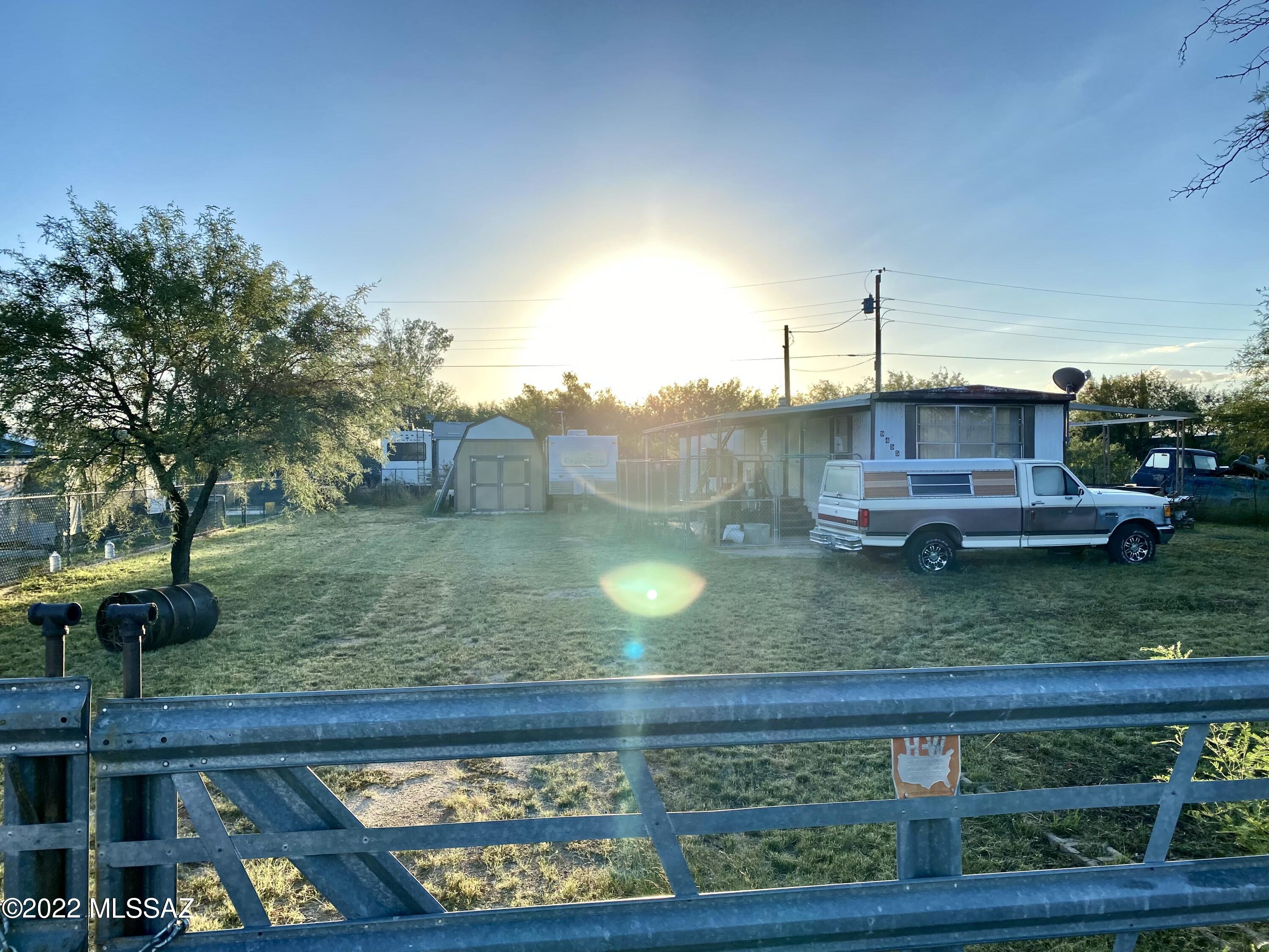 Bring your tool belt and walk into great sweat equity! Inexpensive starter home or rental home on a quarter acre fenced lot. Storage Barn and storage shed, dog kennel and Appliances included. Enjoy the starry night sky, and escaping to your little country spot away from the city commotion!