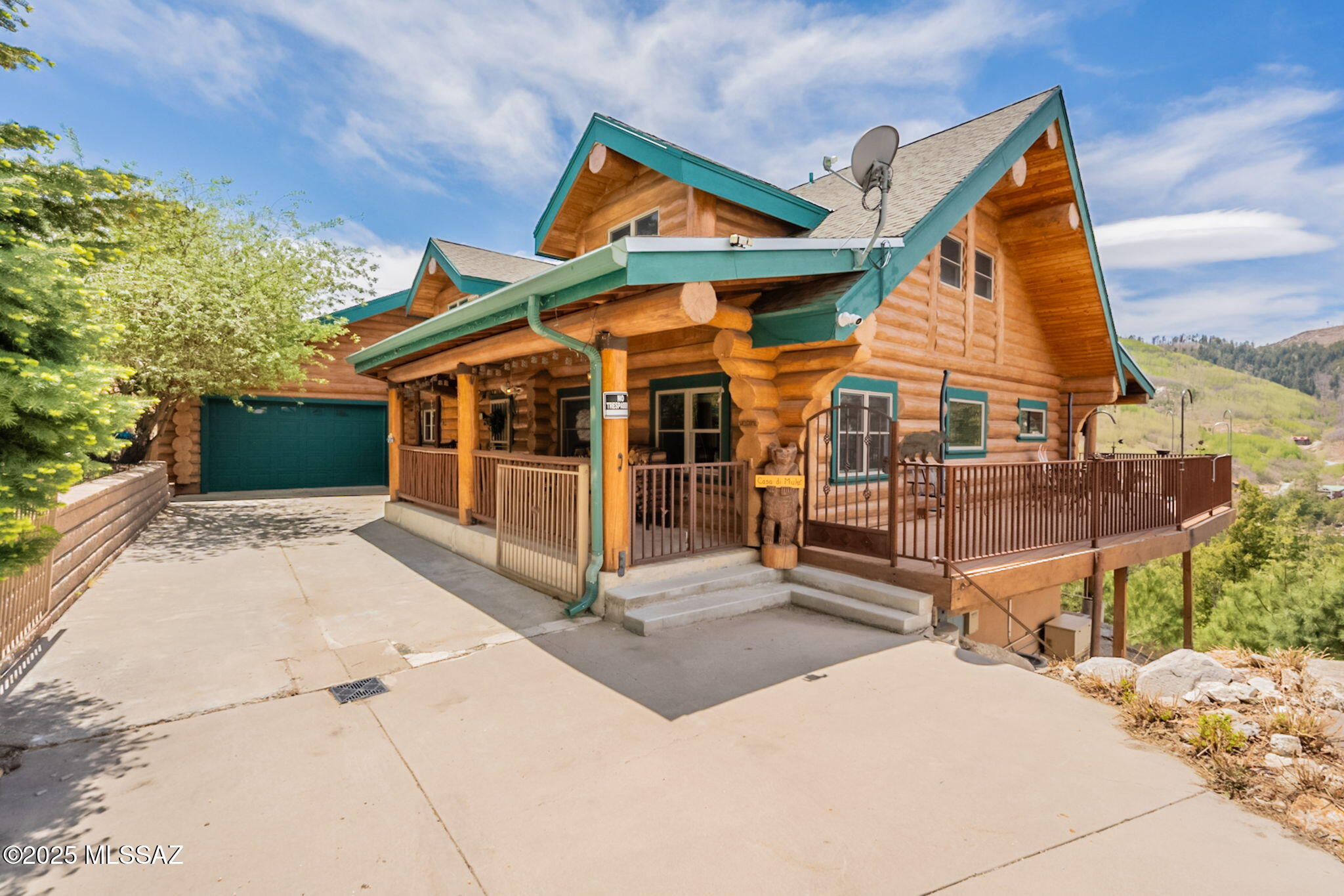 GREAT VIEWS!! Escape from the heat to this stunning turn key, fully furnished cabin on Mt. Lemmon. Handcrafted log cabin from Colorado with 4,939 sqft of living space. Cabin sits on a large lot, 17,461 sqft. Year round access to enjoy all year long! Open Kitchen/great room with unobstructed panoramic views of Summerhaven, the perfect cabin for hosting. Luxurious kitchen includes large island with breakfast bar that seats 6. Stainless steel appliances and granite countertops. Dining area and living area right off kitchen with a beautiful stone fireplace to keep you cozy in the winter months. Large wrap around trex deck with plenty of ample space for outdoor gatherings and enjoying beautiful Arizona sunsets and mountain views. New roof installed this year. Spacious master bedroom on main floor with 2 closets and 3/4 bathroom with a jetted tub and granite counter tops. Second bedroom on main floor that can be used as an office space/bedroom, and a 3/4 bathroom with a shower. Off kitchen is a mud/laundry room with a washer and drier, sink, fridge and storage. Upstairs includes a large loft area with lots of sleeping space and a large storage/kids play room. 2 more bedrooms and another 3/4 bath with shower. Finished basement downstairs entails a reading nook, work out space with equipment and a 1/2 bath. Built in bar, pool table, poker table and covered patio for endless entertainment. Cabin has a 2 car garage with workshop area with great  storage space. Do not miss out on this rare gem of a cabin on Mt. Lemmon.