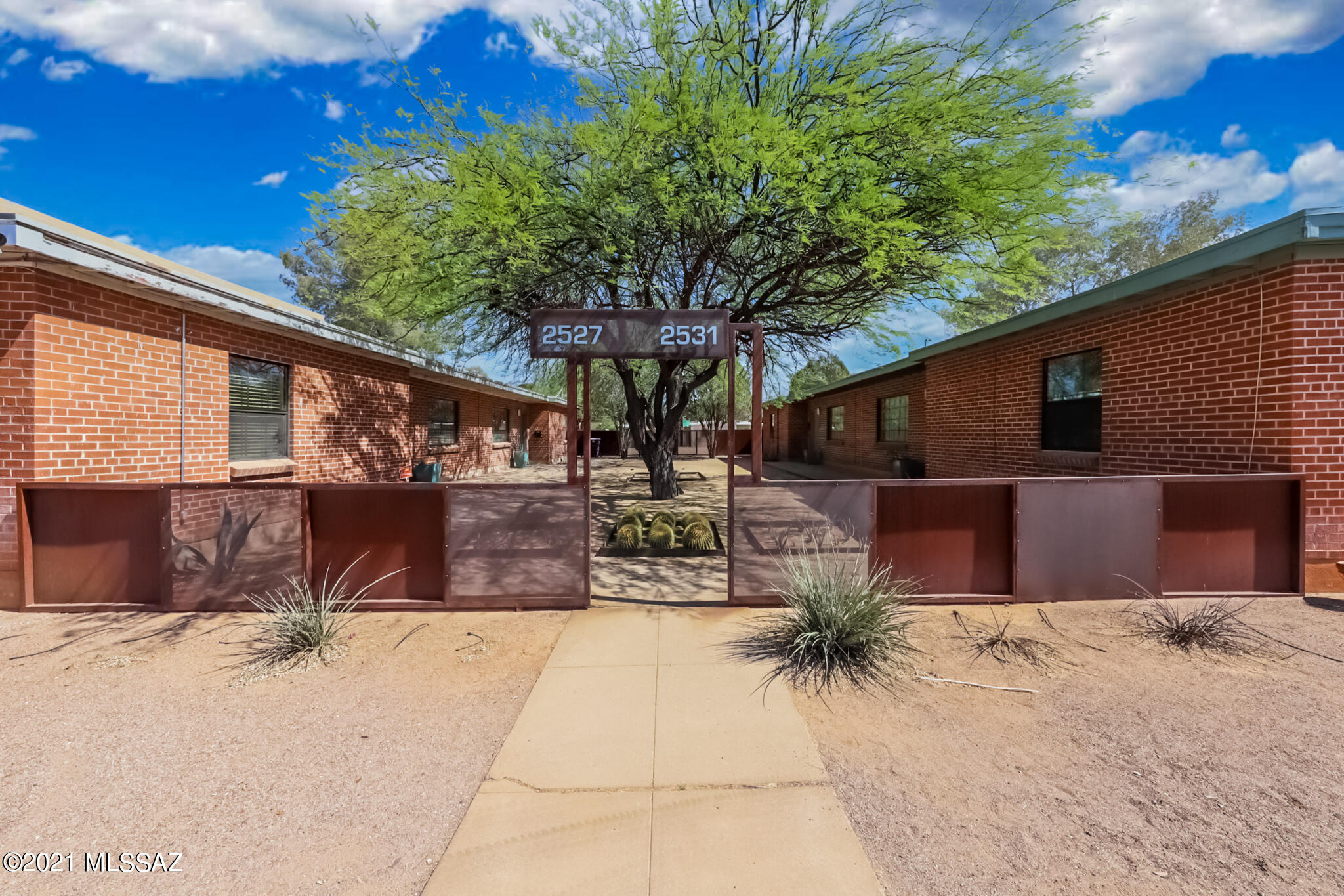This highly desirable duplex, one block from Banner and U of A, is a rare find. Each two bedroom unit has been remodeled. With double pane window and A/C, they rent quickly. Ample off street parking and a single covered parking spot per unit, tops it off! Finally with solidly built brick construction, it's a perfect investment!
