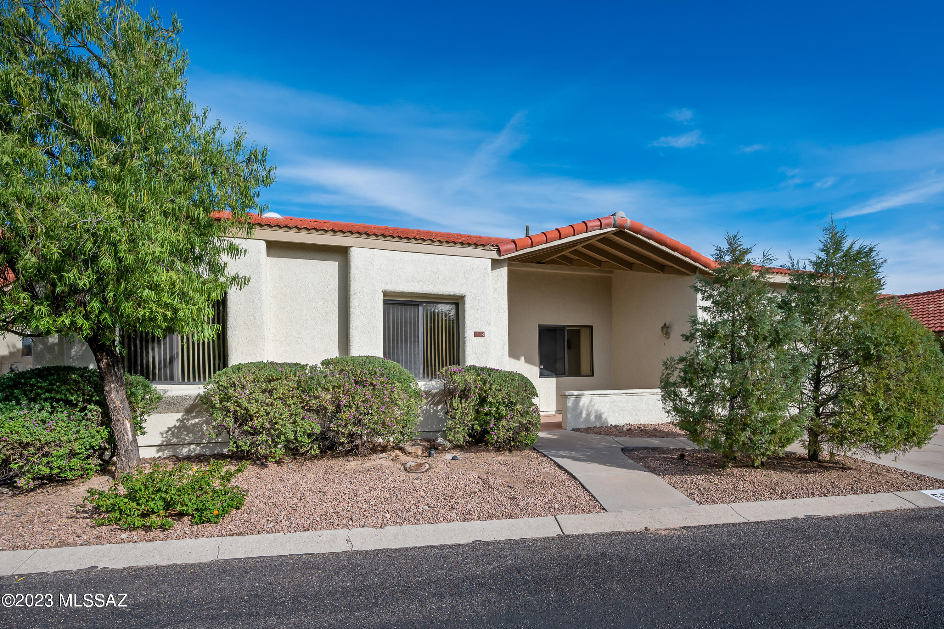 Fabulous home at Sunrise and Sabino Canyon Rd.  3 Bdrm, 2 Bath, loft above master suite with a bonus room w new carpet.  All new paint,, beautiful wood floors in bedrooms, Ceramic tile, lovely bright kitchen with all appliances, cozy gas  fireplace w logs  in great room/kitchen area.  Filtered water,Formal Living and  dining room w beautiful chandelier,  large windows with mountain views, alarm, skylights, ceiling fans & indoor vac system.  Lots of niches for electronics, books, etc. Washer & Dryer in laundry room, nice courtyard entry for patio furniture. Covered back patio with BBQ. Community Pool and Spa.  HOA does front yard maint, and trash pick up . Close to schools, shopping, Ventana Canyon, hiking trails and tram rides.  You gotta love this one! 
 Show to your best clients.
