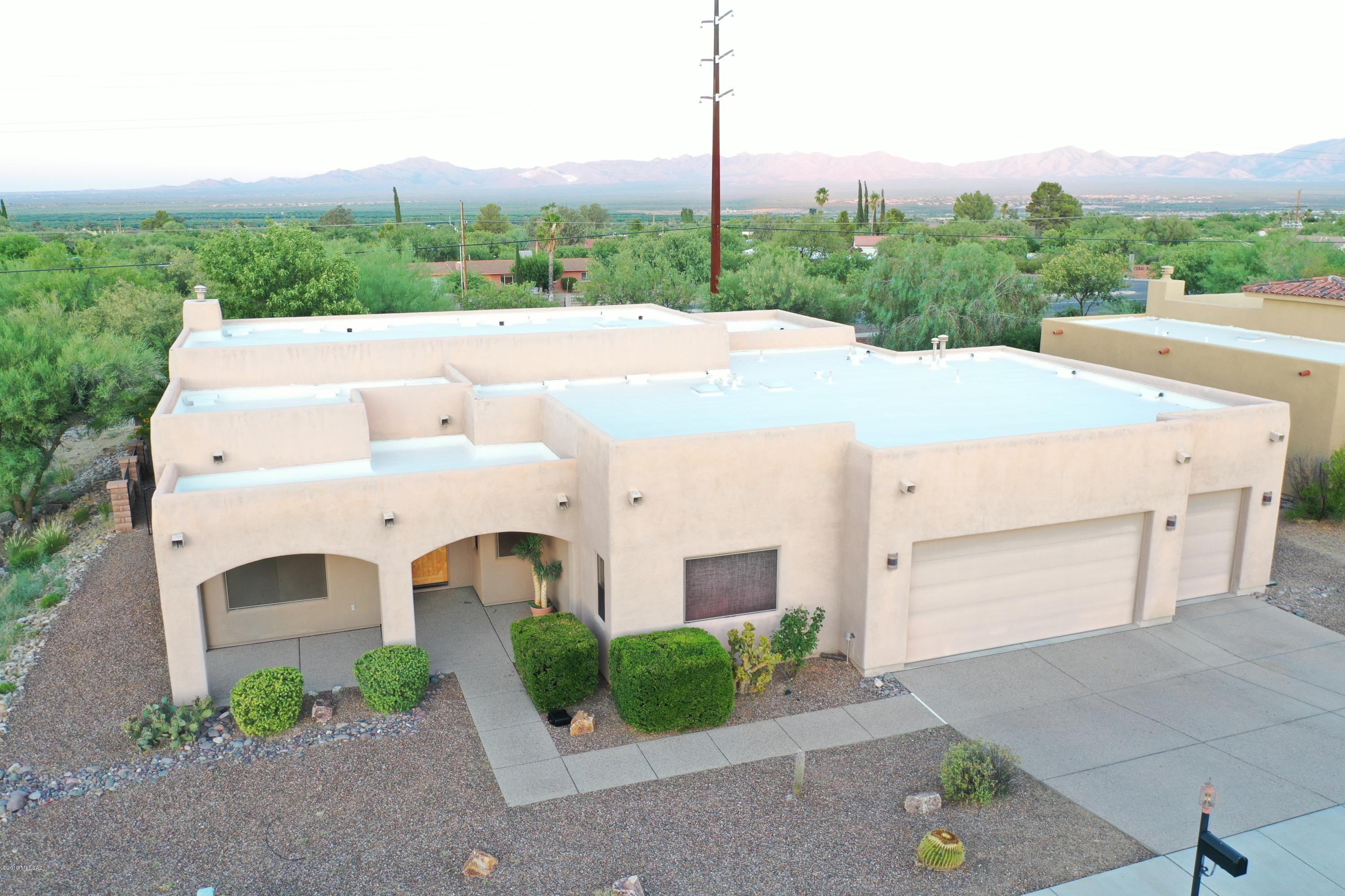 Stunning Santa Fe home offers gourmet kitchen with granite counter tops, stainless steel appliances & double oven. Built-in shelves & niches, grand master suite with jacuzzi tub & beautiful step-in shower. Three car garage with large yard with mountain views.
