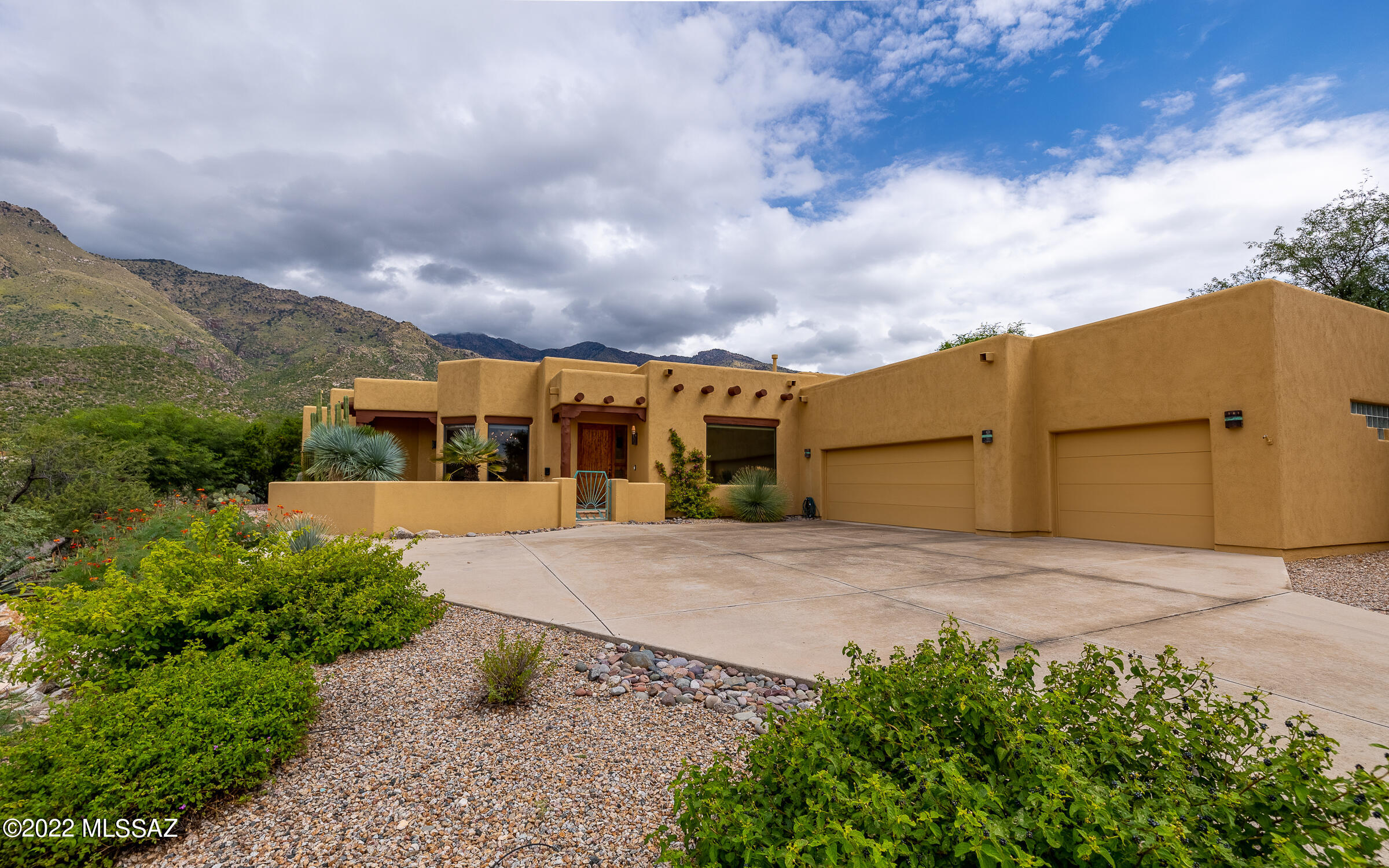 Magnificent mountain views & city lights showcased from this impeccable Santa Fe home. Newly painted w/warm tones creating an elegant, comfortable feel. Fully equipped kitchen w/Alder cabinets, granite counters, walk-in pantry, new double ovens & dishwasher. Family rm includes authentic 15 ft planked ceilings w/Vega beams & cozy beehive FP. Entertain in the formal dining rm or spacious living area featuring sparkling city lights. Split BR offers a spacious primary suite, large jetted tub & dual sinks. Floor plan is designed for an easy conversion for a 2nd primary. New upgrades include; Hunter Douglas shades, new tile flooring & toilets. Retreat outdoors to your 40ft flagstone covered patio & relish the lush landscape, pool & mtn views! Expansive 3 car garage gives vast amounts of storage.