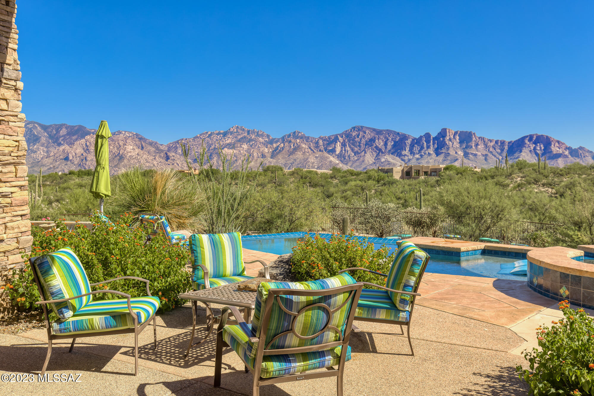 BREATHTAKING & PANORAMIC CATALINA MOUNTAIN  VIEWS!  Absolutely one of the finest view locations (Tortolita Mtn views, too!). Amazing vistas on a very private 2 acres bordering open space in guard-gated Honey Bee Ridge Estates in Oro Valley. Entertainment-oriented Kevin Howard-designed 4,270 SF contemporary offers ~1,600 SF of covered patio w/multiple seating areas overlooking a negative edge pool & spa.  Extensive amenities: floor to ceiling windows, wood ceilings (living rm & patio), Travertine floors, 2016 kitchen (top level granite, soft-close cabinetry, 2 D/W, 2 ovens, warming drawer, M/W drawer, gas cooktop - Wolf/Sub-Zero), Wine Cellar, Wetbar with D/W, Office, 3 Fpls, 3 Suites, Powder Rm, sep Guest area entry, putting green & 3-Car Garage. New HVACs & water heaters. AMAZING VIEWS!
