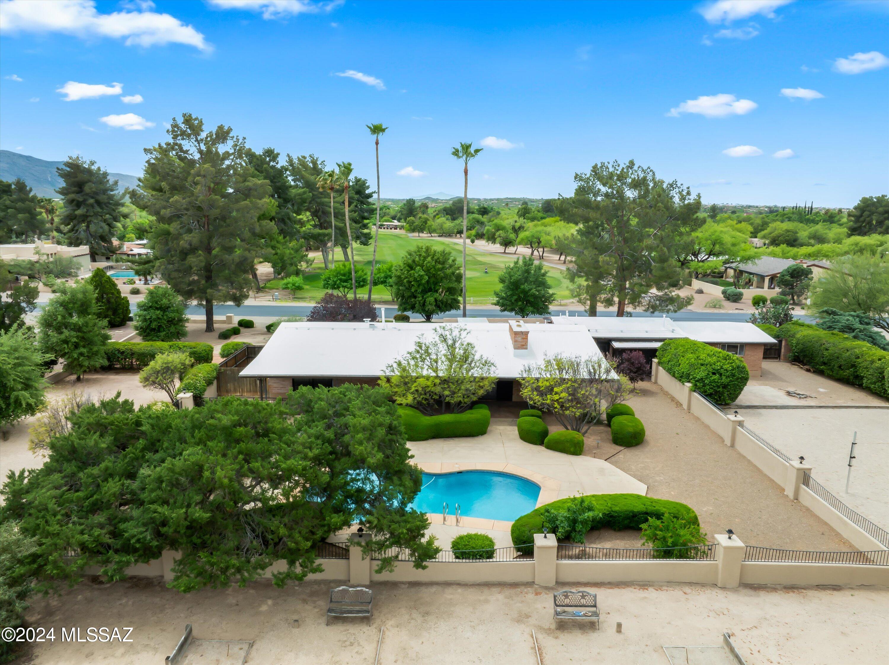 Sensational home in desirable Forty Niner Country Club. This timeless adobe ranch home sits proudly on a sprawling .68-acre lot with majestic mountain views. Step inside and you with be captivated by the rustic charm of the traditional craftmanship with exposed tongue & groove ceiling with wood beams, wall of windows that frame the golf course & Catalina mt views. Kitchen offers a breakfast nook with views of the lush 17th fairway. Gracious primary suite features walk in shower, loads of closets and built ins galore. The expansive backyard beckons with refreshing pool & covered patio seamlessly blends with the surrounding desert landscape, creating a harmonious oasis for both relaxation and entertainment. Friendly neighborhood with fiyness center, resturant and a variety of memberships.