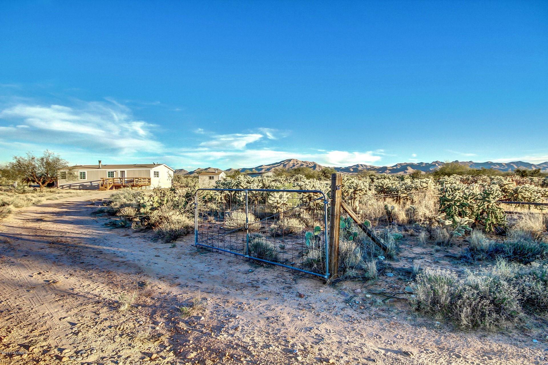 Well maintained 3 Bed 2 Bath Home with incredible mountain and sunset views. 4+ Acres completely fenced, with RV parking to include 50 amps and water hookups. This is a horse property with the convenience of being close to the fairgrounds and only 2 miles from Corona De Tucson. It is also located in the popular Vail school district. This home has so much to offer: Open floor plan, vaulted ceilings, textured 6'' rounded corners ''Drywall'' walls, thermal pane windows, painted inside and out w/natural colors, tiled fireplace, master bedroom w/adjoining garden tub and separate shower. Kitchen has plenty of cabinets and counter space, center island, eating area. Very private lot that sits at the end of a quiet road. At this price it won't last long. Don't miss this one!