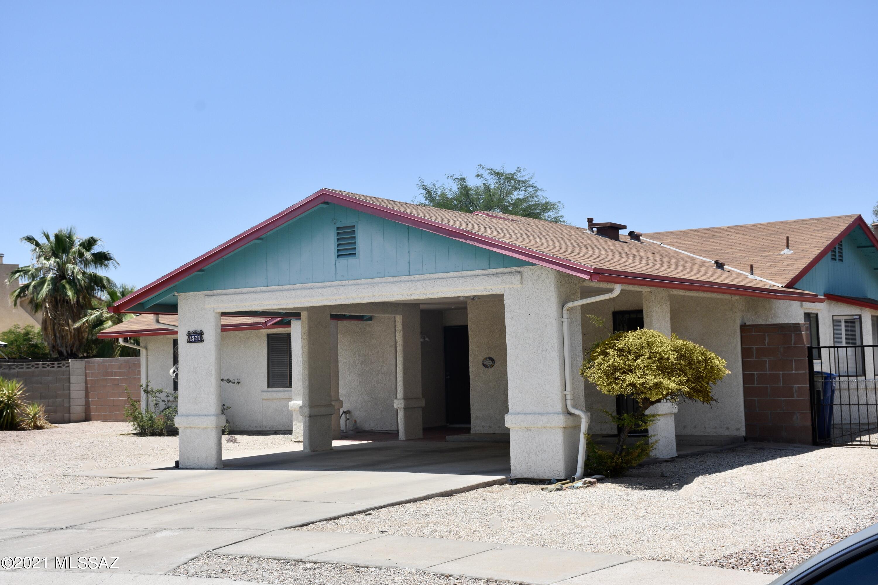 Fantastic location, Northeast Tucson. 3 bedrooms, 2 bathrooms. Updated kitchen, with some newer appliances. Granite countertops. Washer and dryer included. No carpet. Nice skylights. Agreeable paint colors throughout. Nice floorplan. No HOA. Huge backyard, with a drive-through gate, covered back patio, some mountain views from the back yard. large two-car carport with storage. Well maintained with pride-of -ownership, recent AC service, current termite warranty. On the cul-de-sac. Convenient location. Close to schools, shopping, and entertainment.