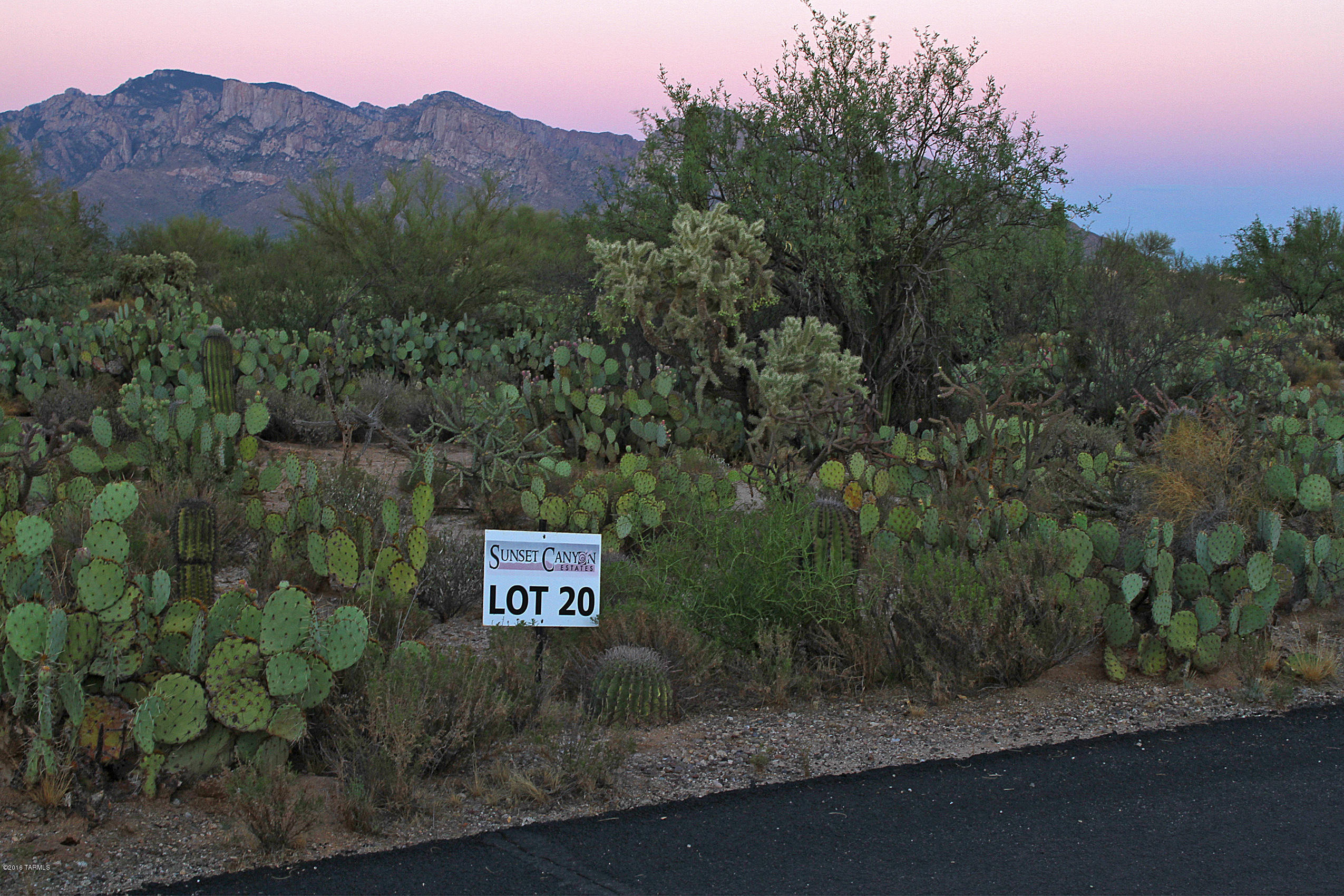 Very unique opportunity to own estate size parcel in the heart of Oro Valley. Enjoy Catalina mountain views with very easy to build flat lot. This lot is part of Sunset Canyon Estates, a small enclave of custom homes. Design your own custom home with our builder or choose from one of our floorplans.  Utilities at lot line. Call to learn more about this lot and opportunities for a custom home.