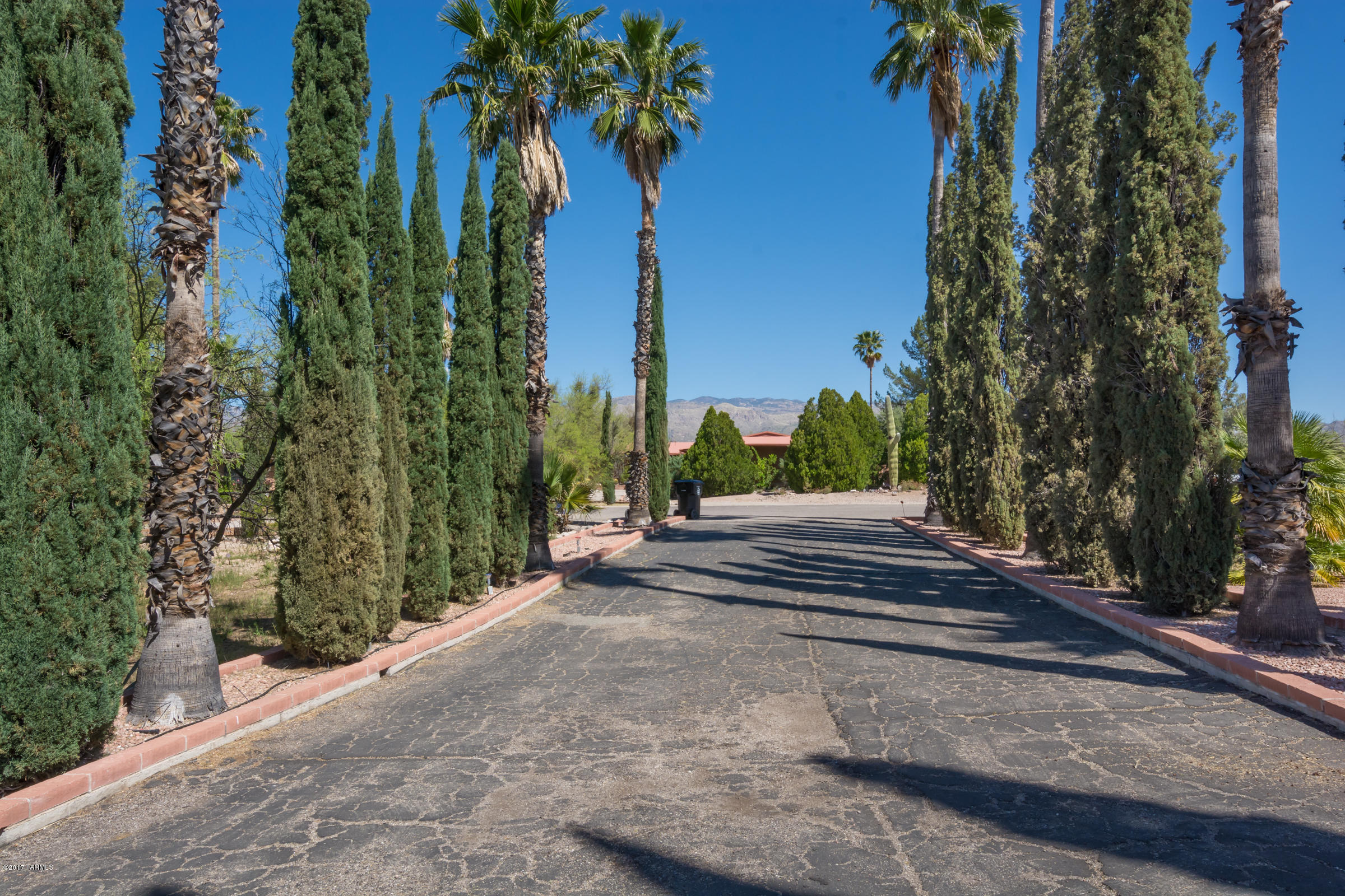 So many upgrades & improvements. Newer windows,floors, paint,bathrooms,kitchen w/granite & SS LG appliances. Built ins in FR, ceramic tile  & wood floor throughout most of the home. Sparkling pool w/gorgeous views of the Catalina & Rincon Mtns. Boche ball court, horseshoe pit as well as shuffleboard in this large party backyard. Natural gas to the grill. Updated bathrooms with granite tops. Auto rolling shade on French doors to backyard from master bedroom & Pello windows too.