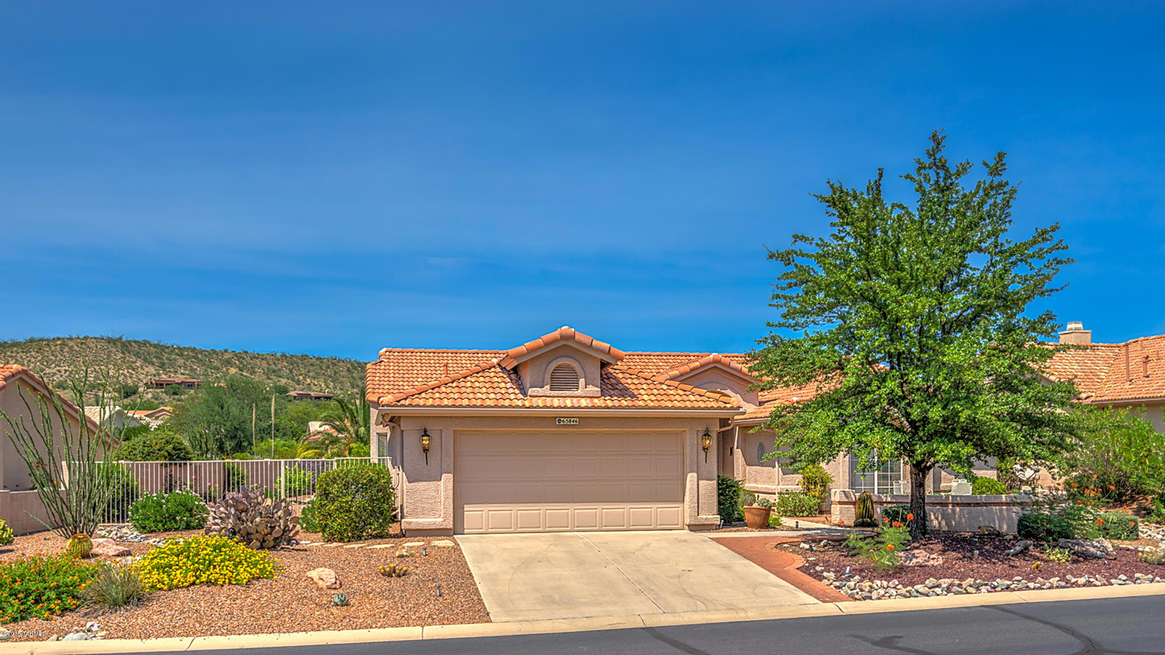 Terrific TOPAZ w/8-foot Garage extension! Just completed . . . new, interior paint in a pleasing, neutral palette throughout. Extra 2 feet added to both the Guest Bedroom & Office/Den. 2 Bed/2 Bath home w/Office/Den + a large Hobby/Craft room between Kitchen & Garage. Kitchen is adjacent to a large Breakfast Nook & Family Rm. Corian countertops w/seamless, integral Corian sink. Guest Bath tub is larger than standard. Five ceiling fans, vaulted ceilings, a Solatube in the Hobby Room & security doors on front entry & Master Suite doors. Backyard is spacious: covered brick patio w/seating extension, bricked elevated planter box, lovely rock waterfall feature & extra side yard space which adds to the home’s privacy. Well cared for home, sparkling clean, light & bright & ready for your move-i