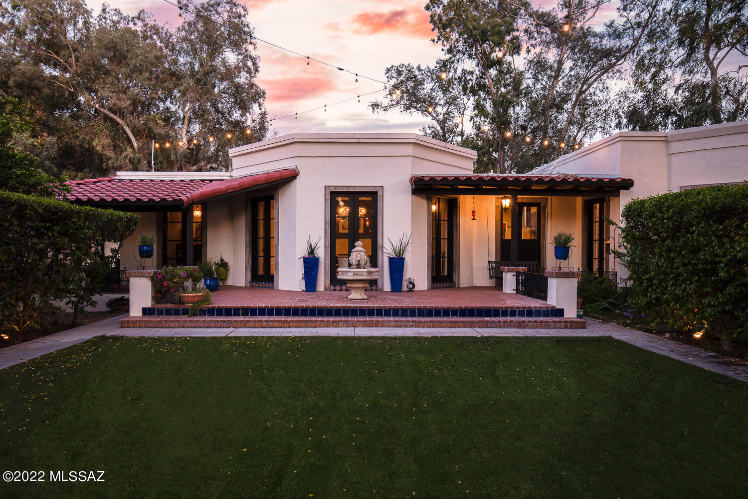 Gated compound within Tucson Country Club. A French country garden, waterfall pool and spa, beautiful antique doors and gates, 2
outdoor kitchens, an outdoor wood-burning fireplace, an interior courtyard and mature fruit trees.