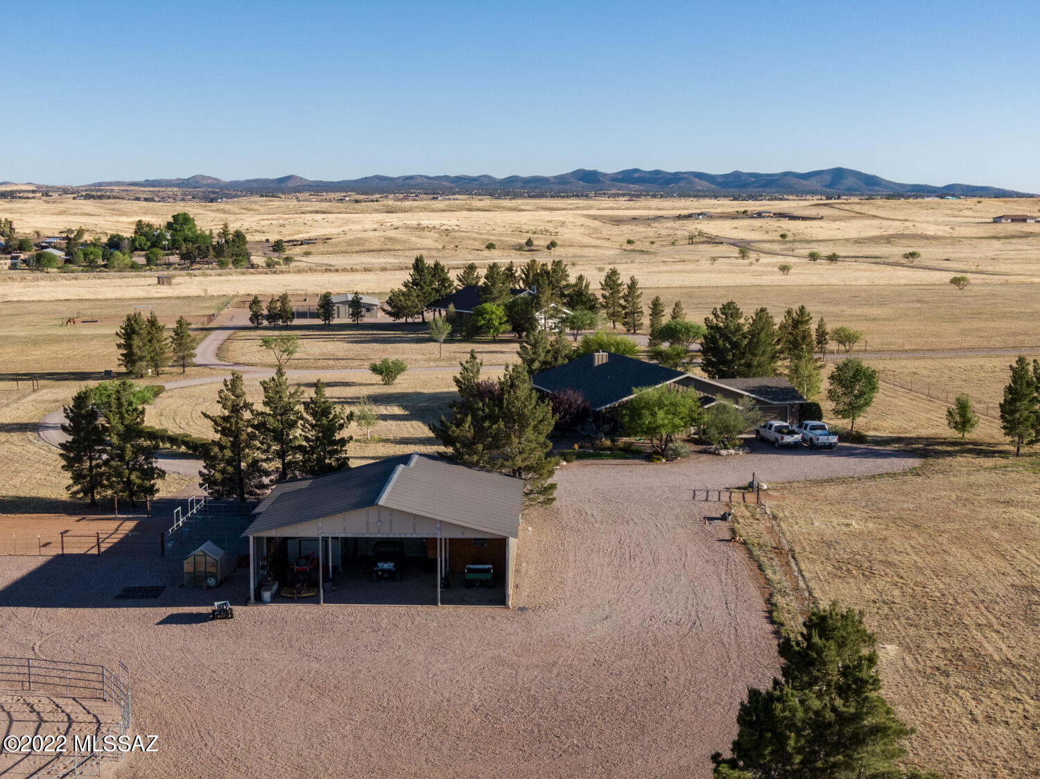 Ranch Style Country Home with county location near Sonoita with paved road access owner built with love and care expansive views in every direction large covered patios front and rear 3 bedroom 2 bath split floor plan vaulted ceiling great room open to dining and kitchen with granite counter tops distressed knotty alder cabinetry large laundry room with sink off extended garage whole house water purifier beautiful barn built by Barry Burton designed with the equestrian in mind with 3 oversized stalls 14'x12' each + turn outs + Nelson heated waterers tack room Â½ bath horse wash stall with washer and dryer hook up hay storage area and horse set up with attached RV and equipment garage with storage room entire property is smooth wire fenced and cross fenced two share well with good product pretty landscaping surrounds the home gravel driveways + spots to park 4 RVs with water and electric one with RV dump