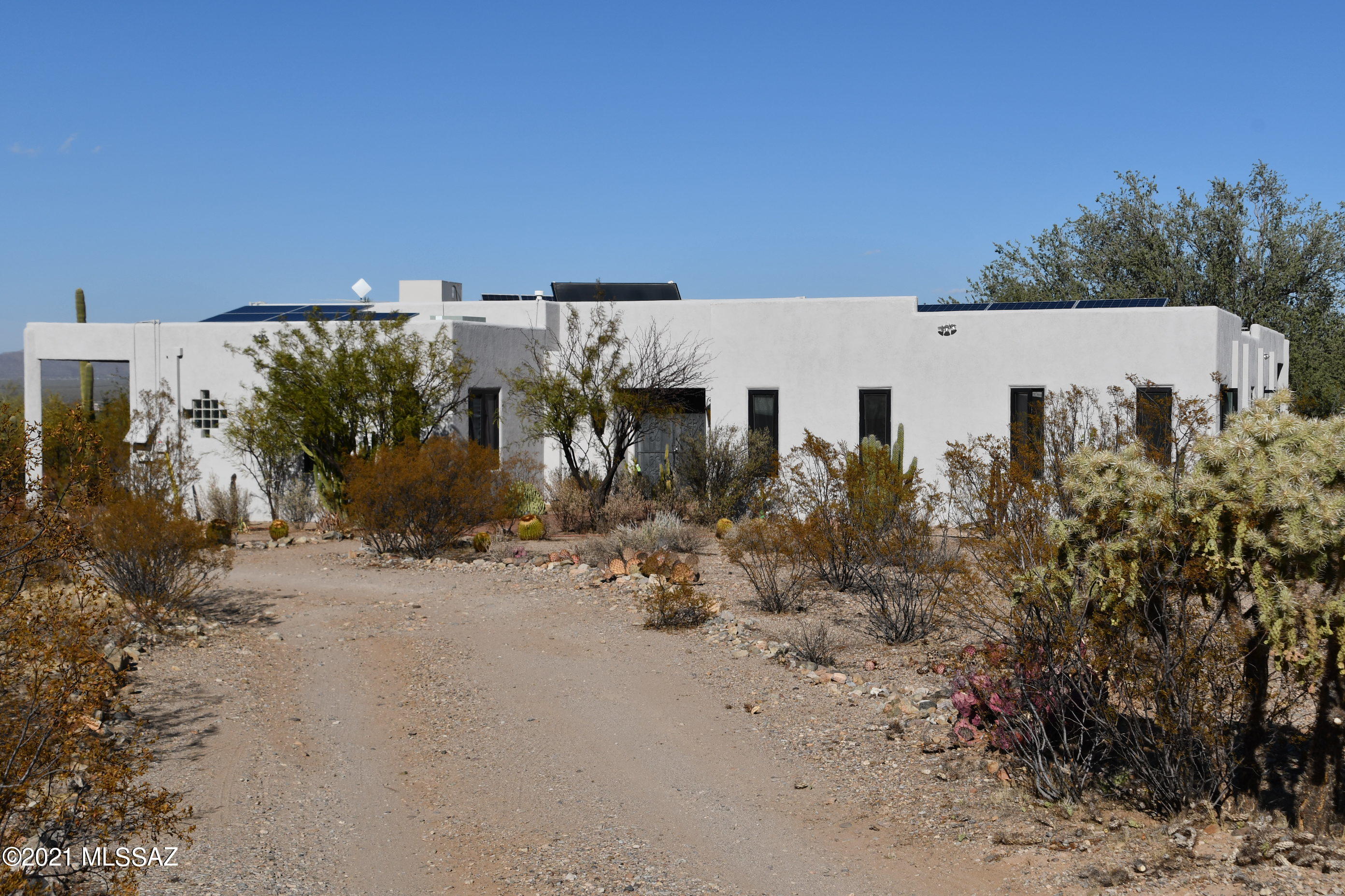 Ironwood Ranch, a diverse property of abundant natural beauty with native vegetation and mature saguaro. Located only a couple miles from I-10 and major shopping, this property offers opportunities for tranquil living, rental income, or investment potential. All improvements currently rented so showing can only be arranged with accepted purchase contract. property consists of 27+/- acres Suburban Ranch zoning (3.32 acre minimum lot size), 3000 SF custom 3 BR, 2BA home w/den & office, & 12' wrap around porch. Floors are tile (master is granite), high ceilings, extensive solar energy, dual cooling & so much more. AT this time, the home & 5 separate rental units are tenant occupied. The 2 greenhouses which are also leased. See additional documents for more info.