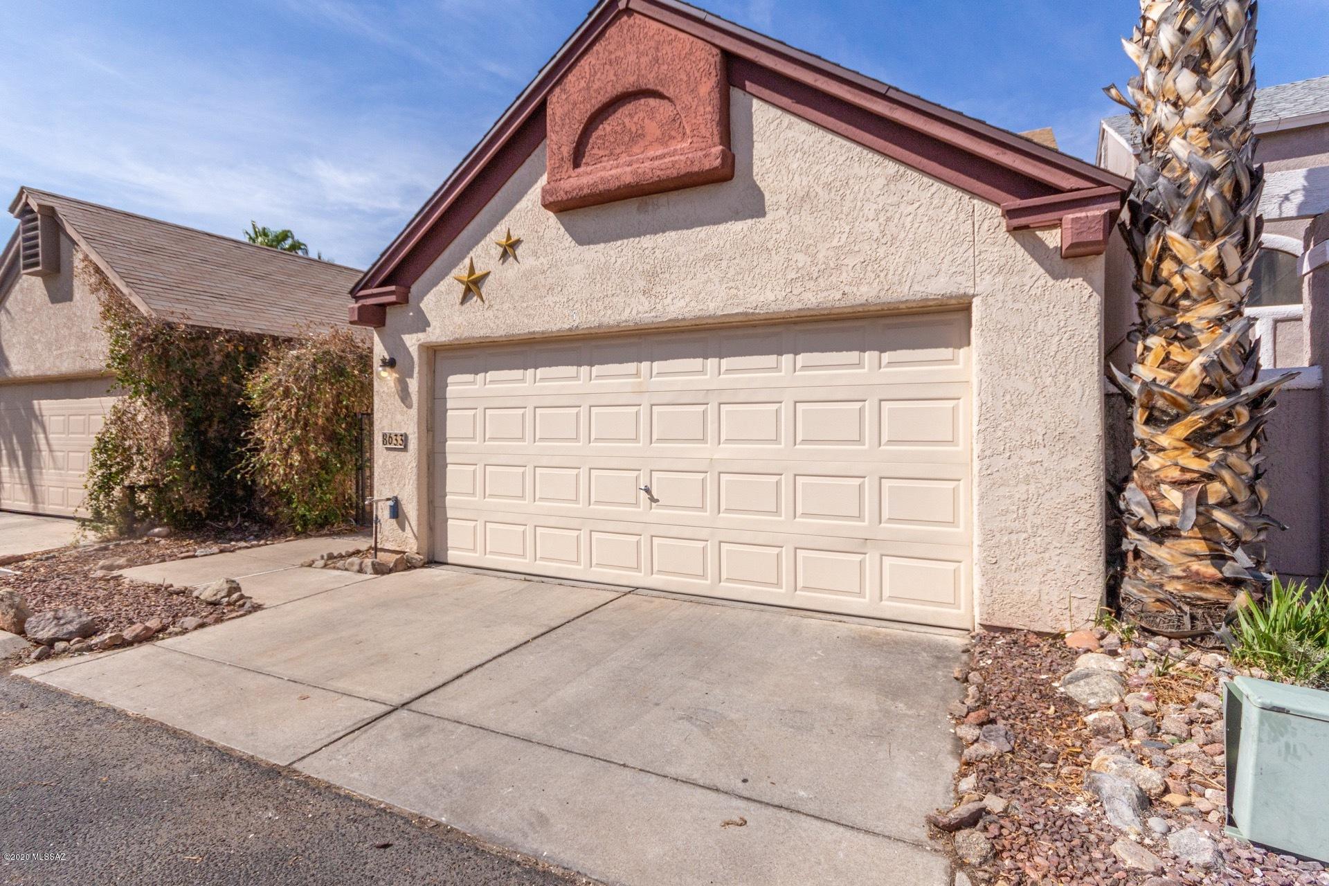 Charming 3 bedroom, 2.5 bath two story home with 2 car garage located just West of Tucson National Golf Course. Gated courtyard entry and No neighbors behind provides highly sought after privacy that is difficult to find!  Once inside this natural light filled home, you are amazed with the spacious living area that flows to the dining room and kitchen with stainless appliances. Downstairs master is oversized with walk-in closet,  patio access and full bath. Upstairs hosts two guest rooms separated by their dedicated bath with tub/shower combo. Another 1/2 bath a laundry inside is a plus! Home has no carpet in living areas and has been updated with engineered wood flooring in the bedrooms. Rear yard has enough space to create your own oasis. Community Pool! Solar Energy keeps costs low!
