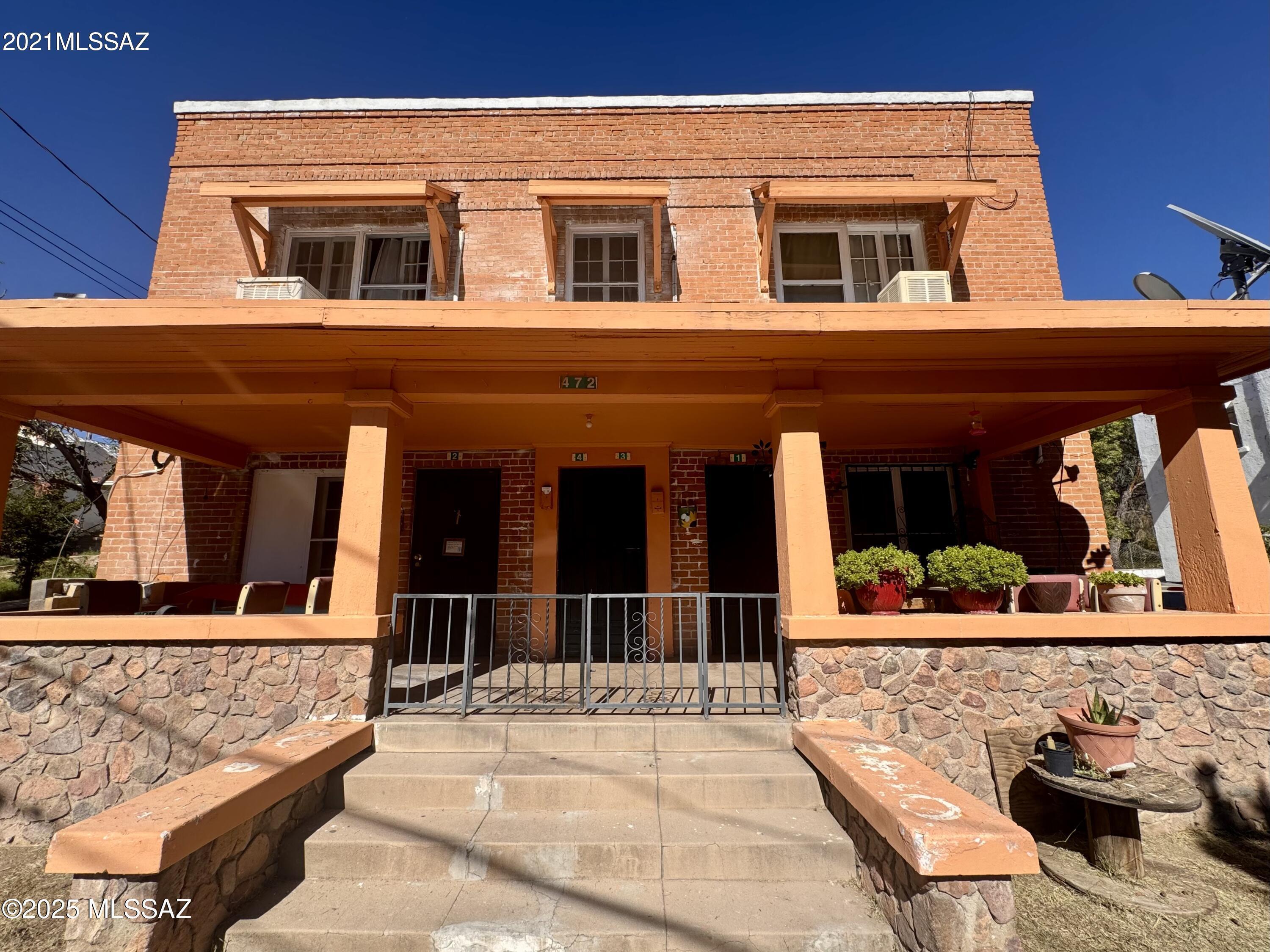 Discover a rare investment opportunity in downtown Nogales, AZ, with this charming 1915 two-story brick territorial four-plex located on historic Walnut Street.  Its prime location places it within walking distance of all amenities in both Nogales, AZ, and Nogales, Sonora. The building comprises of 3 spacious 2bd/1 bathroom units, each measuring 1,106 sq. ft., and a 1,526 sq. ft. 3bd/ 1 bathroom unit. Each unit has its own fireplace and washer/dryer room. The ground-level units share a welcoming porch and a front yard, securely enclosed by a fence. The lot in back has ample space for more units/income! Each unit is separately metered for electricity and gas. Current tenants are month to month. Listing agent is related to seller