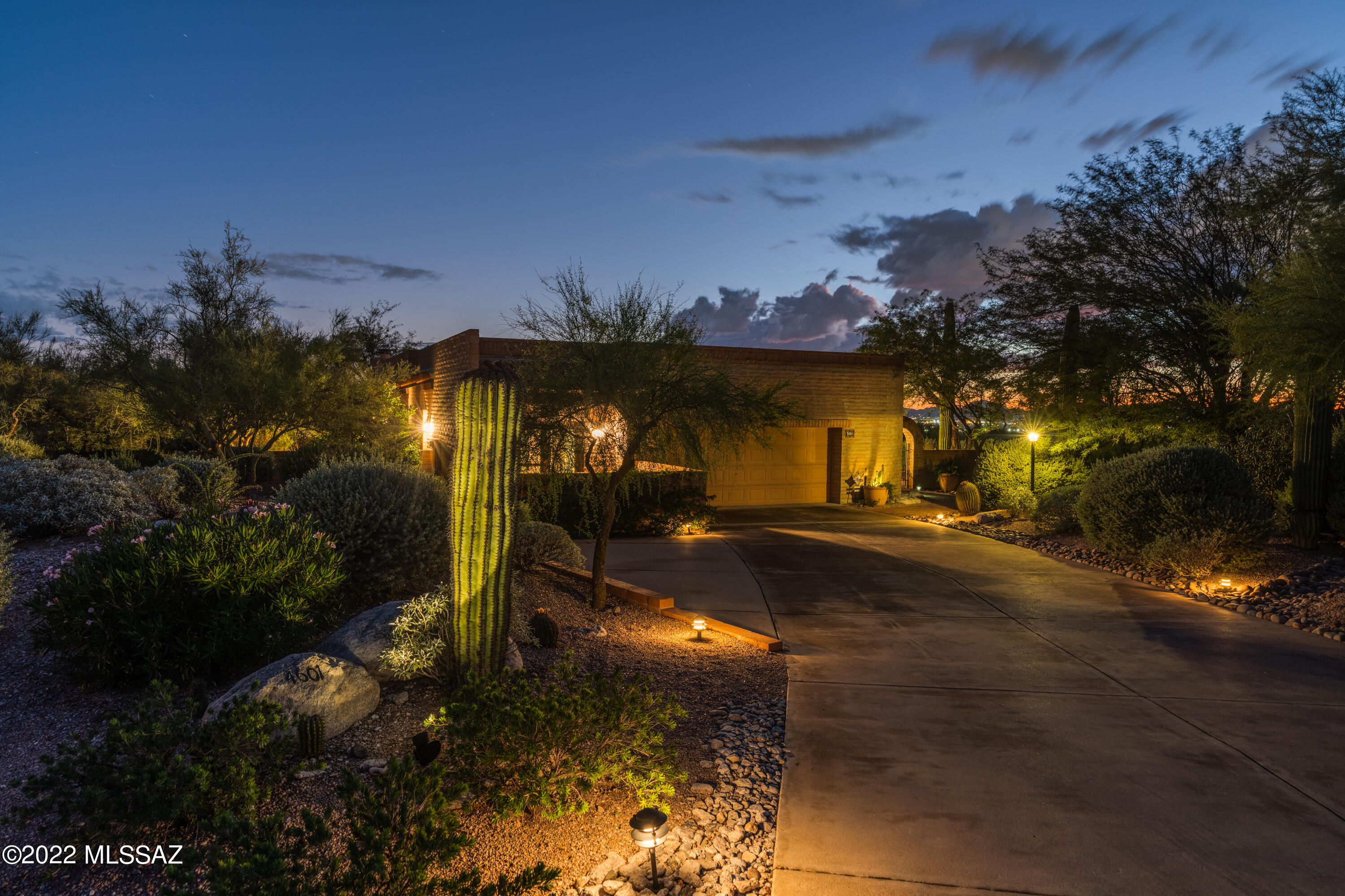 Fairfield in the Foothills at its very best...views, privacy, nature, and the stunning and unique floorpan make this custom home a standout! This home is NOT a typical builder floor plan, so upon entering, you will see all the custom features such as: flagstone and hardwood floors, soaring ceilings throughout, 3 gorgeous wood burning fireplaces, wide hallways, loads of picture windows and doors to allow views of the Catalina & Tucson Mtns, sunsets, city and valley lights at night that will take your breath away. This home is perfect for year round entertaining for groups of all sizes! You have a pick of any patio for dining and relaxing all while protected from the heat regardless of the time of day!

From the grand entry door to the flexible, open floor plan this 2 bedroom and a den, (which could also serve as a third bedroom), has an elegant living area, large dining room with stunning views, and an open kitchen with cozy sitting area.  Don't miss your opportunity for a one of a kind home in Fairfield! Other features include: large laundry room/hobby room with 1/2 bath, built in storage and closet in garage, extra parking, plantation shutters, wood interior doors throughout, nothing about this home will disappoint. Community has pool, tennis and spa.  Welcome Home!