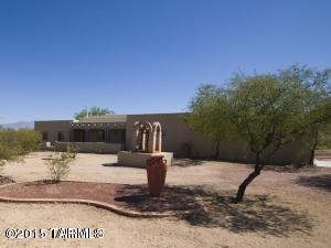 Beautiful 2772 sq. ft., custom built, southwest style home on a one acre lot. 4 bedrooms and 2 baths, dining room, large game room, with satillo tile throughout the living area and carpet in the bedrooms. Large covered patio with enclosed courtyard, covered patio off master bedroom, two car garage with storage cabinets and large work area. Mature landscaping, located at the end of a cul de sac in a quiet neighborhood.