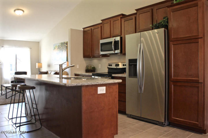 Please call Erica Poplin @ 520.904.2143 to schedule a showing!

Beautiful 3 bedroom, 2 bath house. Open, light and bright with open concept living and dining areas. Huge island with seating, pantry cabinet,  flat top electric stove and much more. Granite countertops in both kitchen and bathrooms. Tile floors in all main living areas and baths. A MUST SEE!