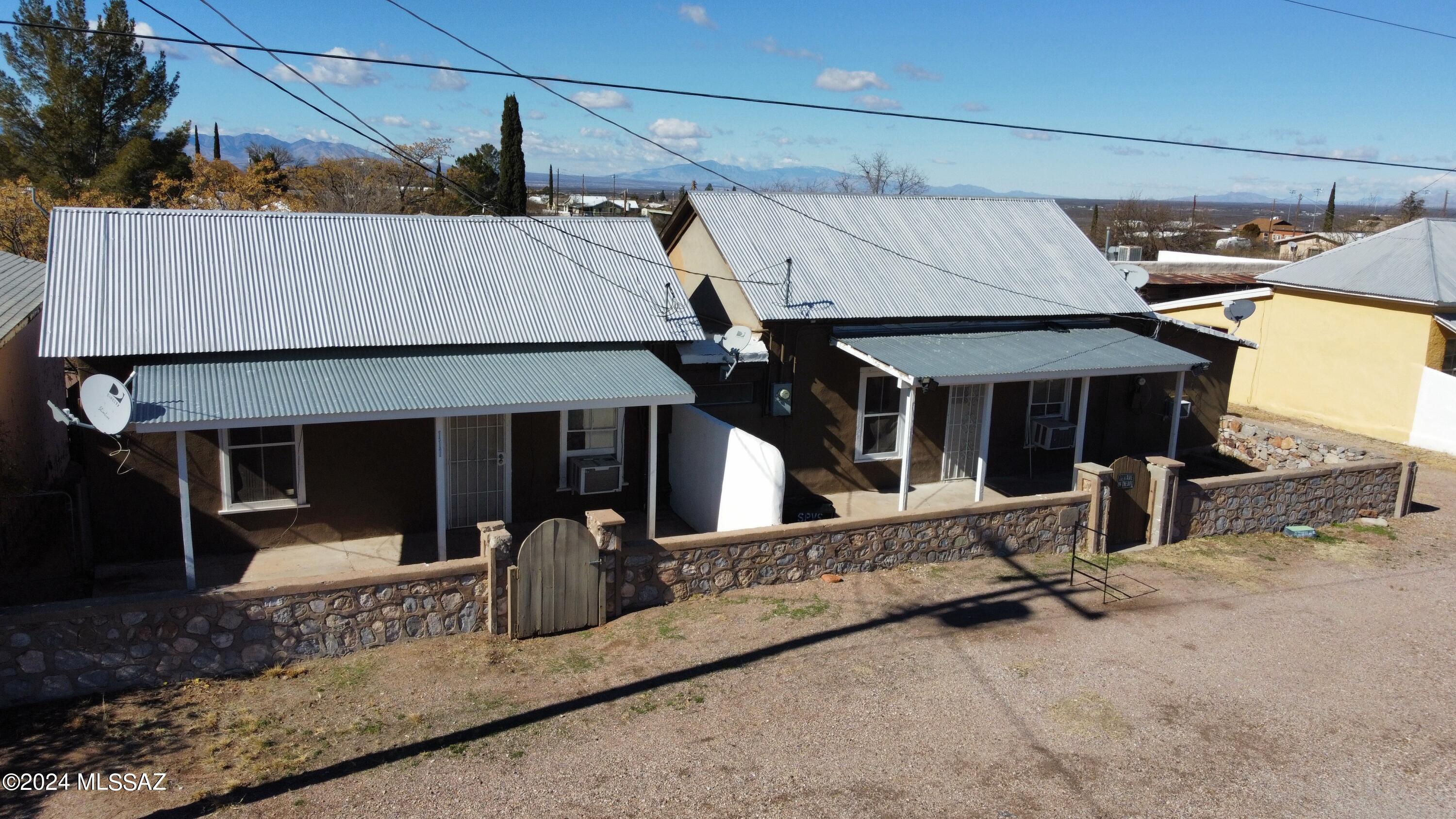 Residential multi family units in Tombstone Arizona. This potential money maker has everything you need for a long term or short term rental. 4 total units that have been long term rentals in the past, but the efficiency units could be made into short term airbnb's. Walking distance to all the attractions, this property sits on a quiet residential street with ample parking and views of the dragoon mountains. Close to Walter J Meyer school and restaurants and shopping.