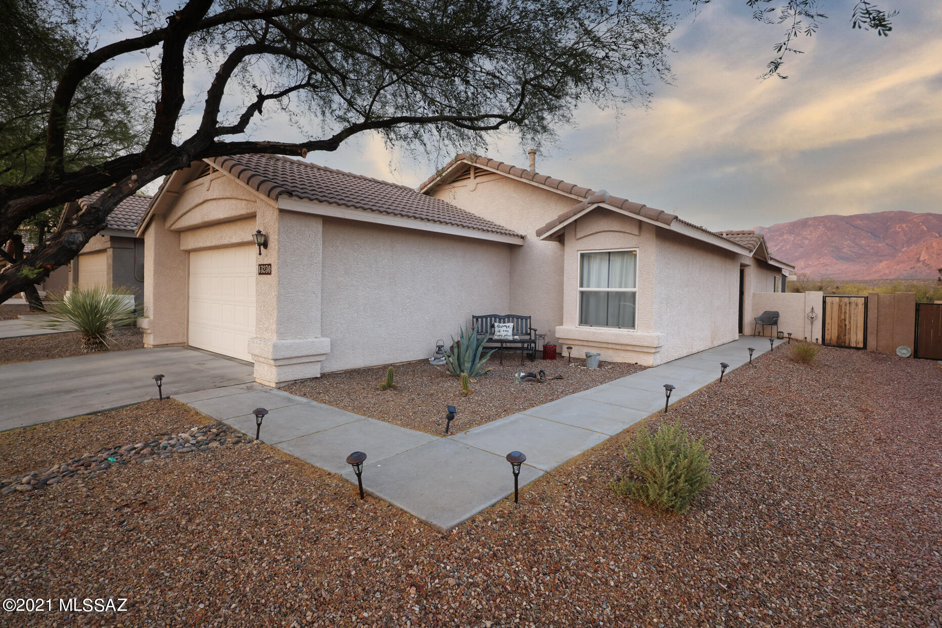 Want that ''Million Dollar'' panoramic unobstructed mountain view of CATALINAS/Pusch Ridge?? Tastefully decorated and move in ready. Open floor plan giving you lots of natural light with a screened in rear porch to sit out and enjoy the views over looking a huge rear yard. All appliances stay and are in ''AS IS'' condition; updated bathroom cabinets w new light fixtures; ceiling fans; built-in cabinets for extra storage in laundry rm; garage has a 6 foot extension; this ideal split  floor plan is wonderful. Perfect great started home or down sizing..better yet ideal for a winter visitor...shows really well. seller will not do any repairs.