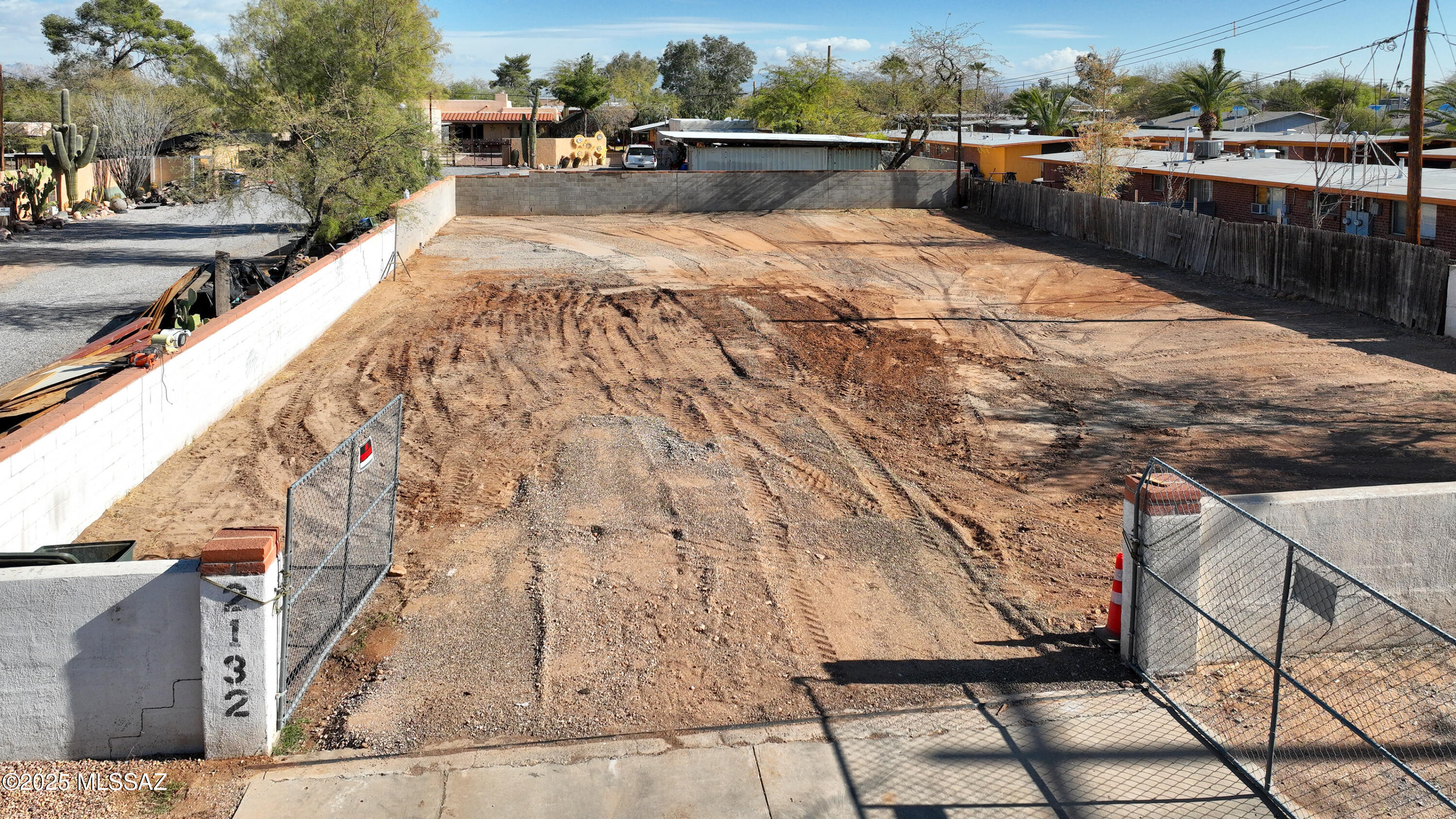 Discover an outstanding opportunity in the highly sought-after New Deal Acres neighborhood! This versatile 0.19-acre lot with R-2 zoning offers endless potential for your dream home or duplex. Recently cleared and fully fenced/walled in, the property is ready for development with all utilities conveniently located at the lot line. Enjoy a prime central location just minutes from the University of Arizona, Banner Medical Center, beautiful parks, popular restaurants, and vibrant downtown Tucson. Whether you're an investor, builder, or future homeowner, this property combines convenience and potential in one of Tucson's most desirable areas. Don't miss out on this rare find!