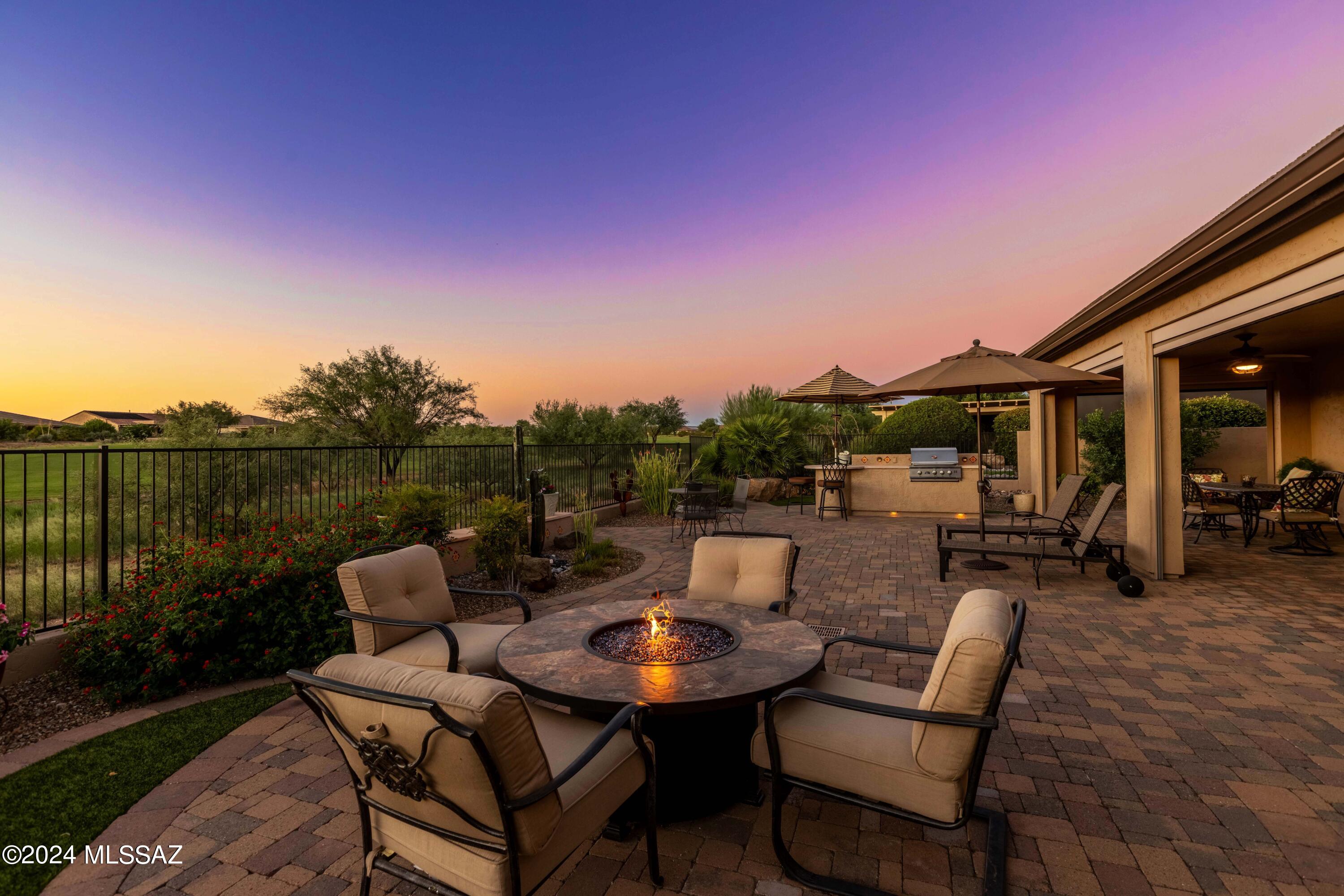 Discover the epitome of luxury living in this highly sought-after Mirasol model w/a large Casita and an unbeatable location close to all the amenities.  Experience outdoor living at its best.  A panoramic view of the lush green golf course and magnificent sunset views you don't want to miss! Professionally landscaped, an extended pavered patio, built-in BBQ island.  Rolling screens. Fully fenced. A front travertine paved courtyard welcomes guests and offers a tranquil, peaceful space. Boasting numerous premium upgrades, this exquisite home includes a newly remodeled kitchen.  Built-in walk behind bar/buffet area.  Recently painted inside and out.  Primary Bdrm Bay Window. Custom closet organizer system and so much more.  Don't miss the opportunity to own this stunning home. Why wait?