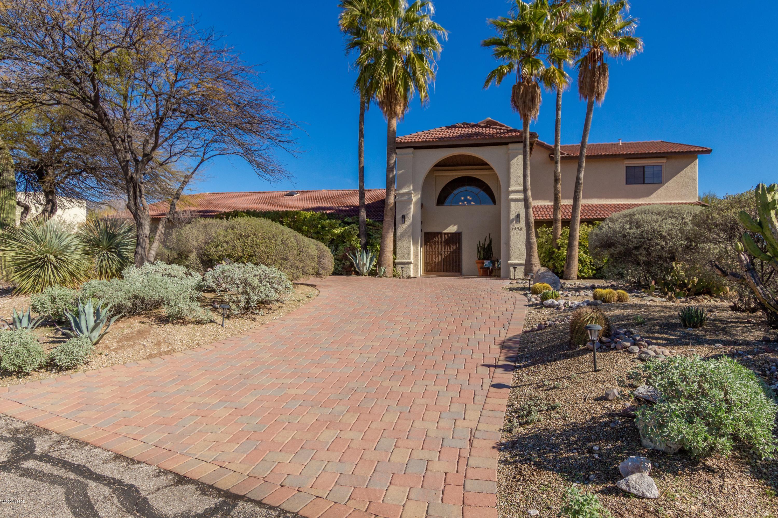 UPDATES & LOCATION! Stunning panoramic views from this oasis ridge-top home make you never want to leave!  Remodeled Fall 2019: NEW bathrooms, wet bar, lighting fixtures, hardware,  paint. The vaulted great room affords lots of light. The open landing boasts views north and south of Catalina Mountains and down into town. You will love this gorgeous property. Come take a look and make it yours today!