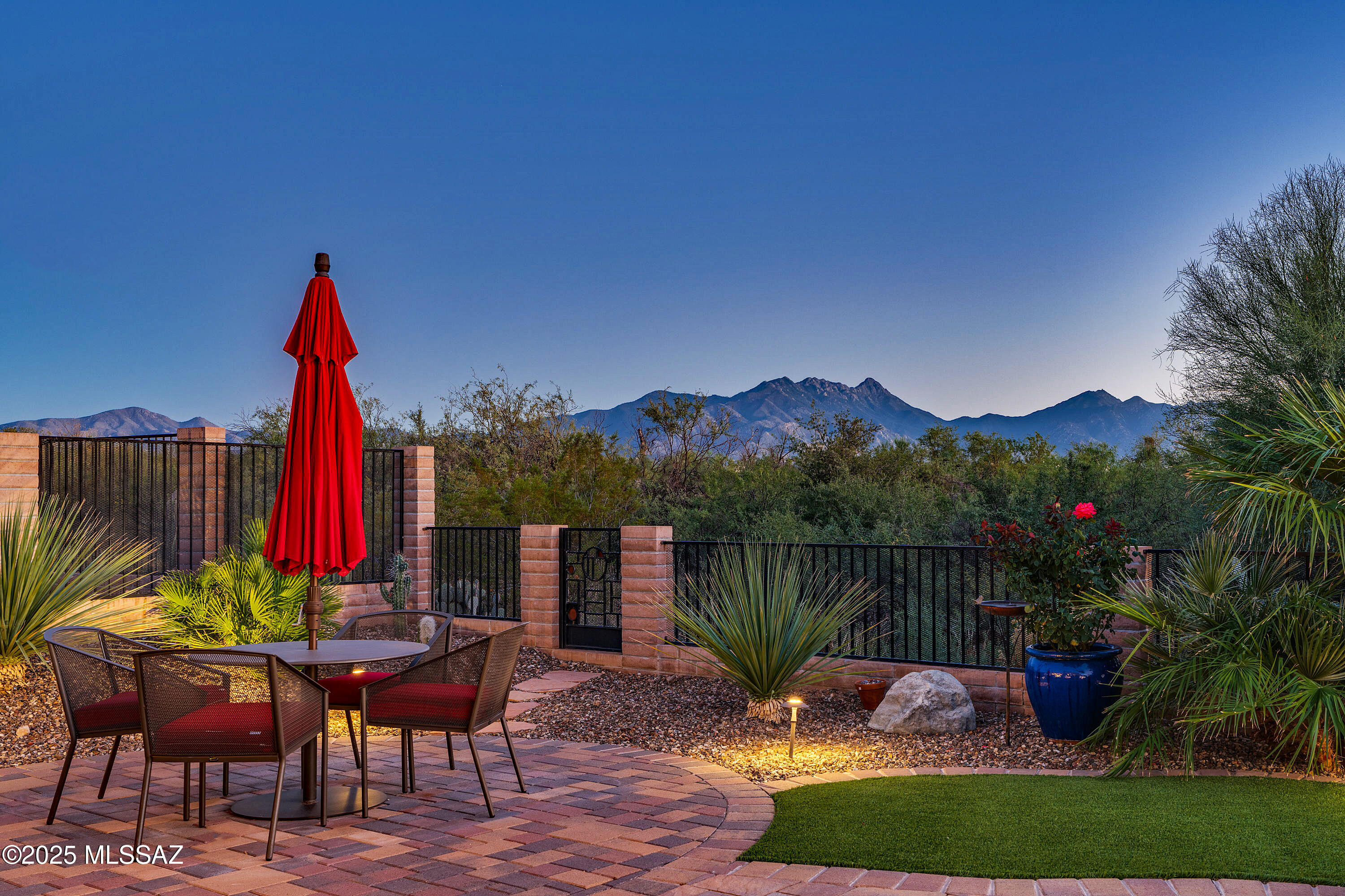 Live your best life and entertain in grand style! This stylish and sophisticated Tesoro in Quail Creek beckons you with stunning, panoramic views, gorgeous stack stone facade, a zen-like courtyard and private casita. This 2,860 sq.ft. home offers 3 BR Suites, 3.5 BA +Den. From the entry foyer and great room, you are instantly drawn to the four, majestic stack sliding glass doors that open to the extended patio and outdoor fireplace. Great room has Swiss & Martin custom built-ins, wet bar and surround sound. The upgraded kitchen offers 2-tone cabinets, GE Monogram SS appliances incl. built-in refrigerator, center island, quartz counters, convection wall oven and microwave, and butler's pantry. Extended owner's suite w/ tile floors, 2 closets, dual vanity bath, tile shower and jetted tub. Extended dining area off the kitchen comfortably seats 8, with slider out to rear patio and outdoor kitchen. The den has custom built-in desk and cabinetry, and a barn door to close off for added privacy. Plenty of room for overnight guests, the main house has a guest bedroom w/ built-in wall beds and en suite bath. Or, step out to the front courtyard to the private entry casita, complete with wet bar, beverage cooler and private bath. Outdoor living is the heart of this home, the extended rear patio offers a stack stone, gas fireplace, outdoor kitchen with pergola and built-in Napoleon BBQ, extended paver patio, fire pit and seating area, pet friendly artificial turf, all thoughtfully designed to enjoy the magnificent mountain and desert views at sunrise, sunset and all hours in between. Bonus features: Upgraded fans and lighting, Plantation Shutters, 5" baseboards, central vacuum, powder room. Plus: Laundry room with added upper and lower cabinets and utility sink; and, Extended length garage, golf cart garage, attached cabinets and epoxy floors. Come see this truly spectacular home!