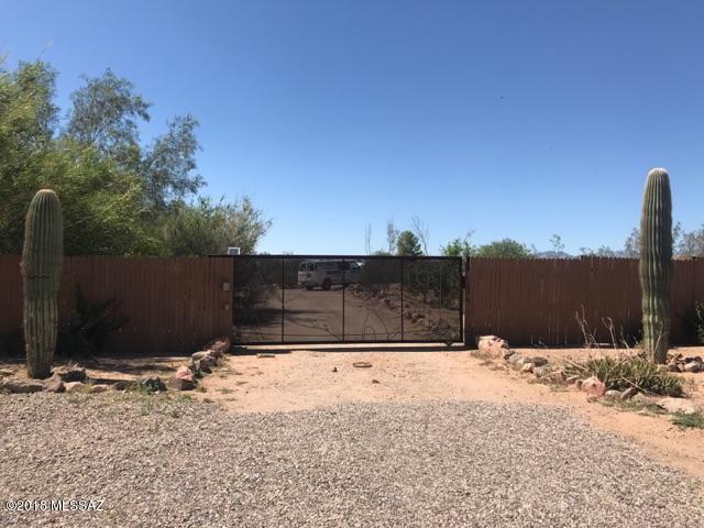 Living large on a Private 2.35 acre lot with a lovely Santa Fe style home that has tons of special touches including Fresh Exterior Paint  The kitchen is  beautifully remodeled and features high end granite tops and beautiful stainless steel appliances including a wall oven and gas cooktop. There is a 3 way remote controlled fireplace. The bathrooms have custom tile work and a glass block shower is featured in the master bedroom with a custom double sink vanity and mirror. This property is perfect for bringing your toys with a double gate and fencing all around. Seller offering 1 year standard home warranty. Owner financing option available with 50% down.
