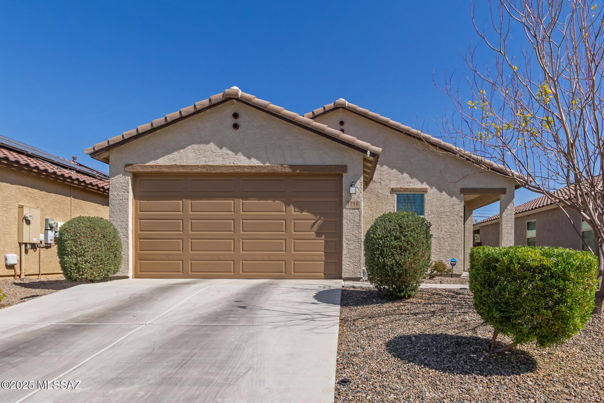 Built in 2021, this stunning single-story home offers a spacious 3-bedroom, 2-bathroom open floor plan with 9-ft. ceilings and a bright, airy feel. The generous great room seamlessly connects to the covered back patio, perfect for outdoor entertaining and relaxation.The stylish kitchen features 42-in. upper cabinets, a center island, and Whirlpool® stainless steel appliances, making it a dream for home chefs. The primary suite includes a walk-in closet and an ensuite bath with a standing shower and dual-sink vanity for added convenience. Designed with energy efficiency in mind, this ENERGY STAR® certified home boasts tile flooring throughout main living areas, plush carpeting in the bedrooms, Sherwin-Williams® low-VOC paint, and Moen® WaterSense® labeled fixtures in the kitchen, and baths. Additional upgrades include an epoxy garage floor, a water softener, and a full exterior repaint in October 2024. Located with easy access to Northwest Tucson, this home is move-in ready and waiting for its next owner. Don't miss out on this incredible opportunity, schedule a showing today!