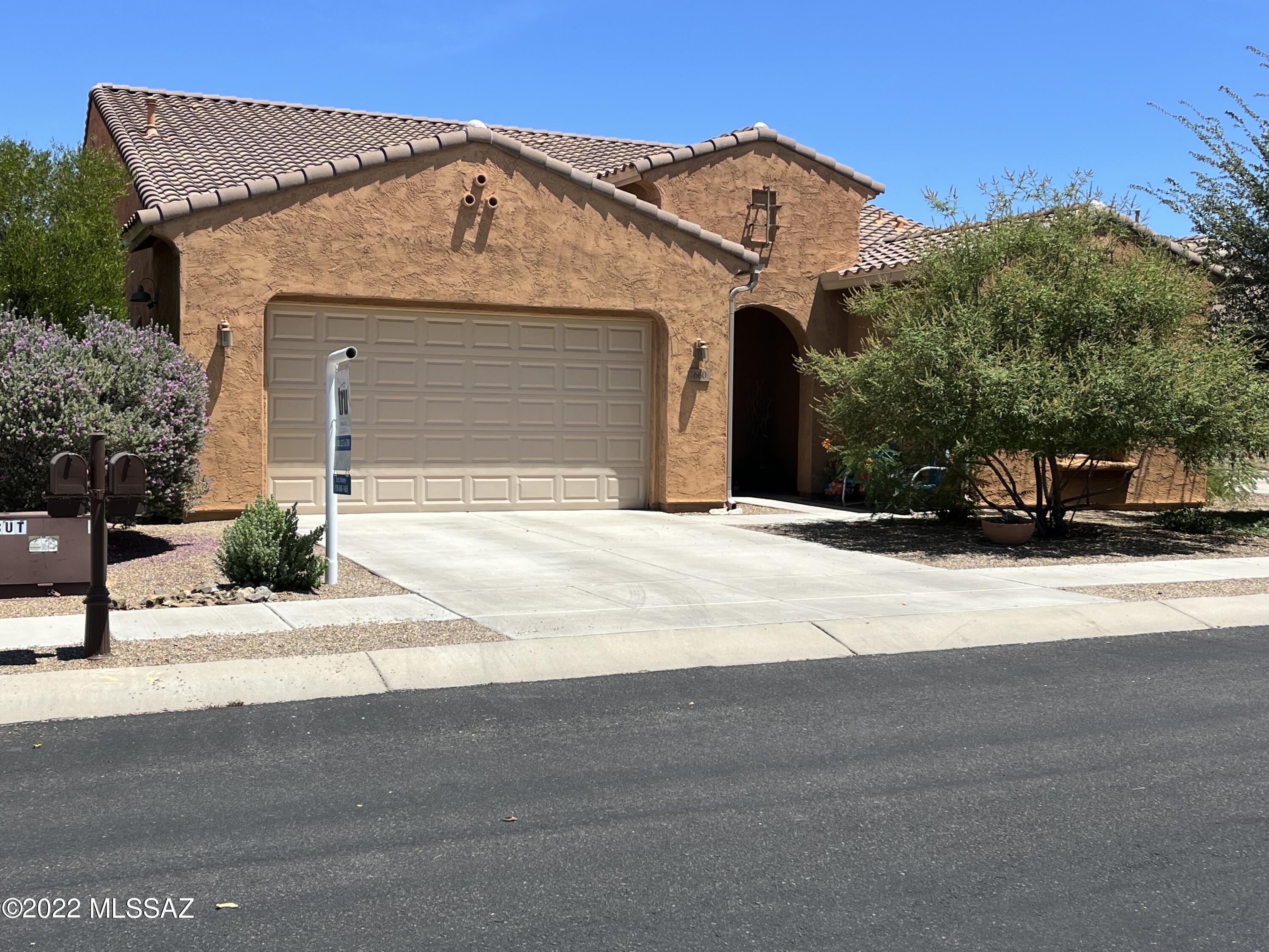 This beautiful home in Rancho Sahuarita is located in the sought after community of Entrada Bonita. The community is quiet, has mature vegetation and is gated. The home includes 3bd/3ba plus den with a 3 car garage. The homes backyard faces north for cooler days and backs to a wash. Backyard also includes a covered patio with pavers and grass. Raised garden beds conveys with the home. Front yard has desert landscaping with water sprinkler system in the front and back yard. Open concept floor plan also includes a den which can be used as an office or guest room. In addition home has  a separate formal dining room which is currently used as a children's study and activity area. The HOA includes an ABUNDANCE of amenities and activities throughout the communities to keep residents occupied.